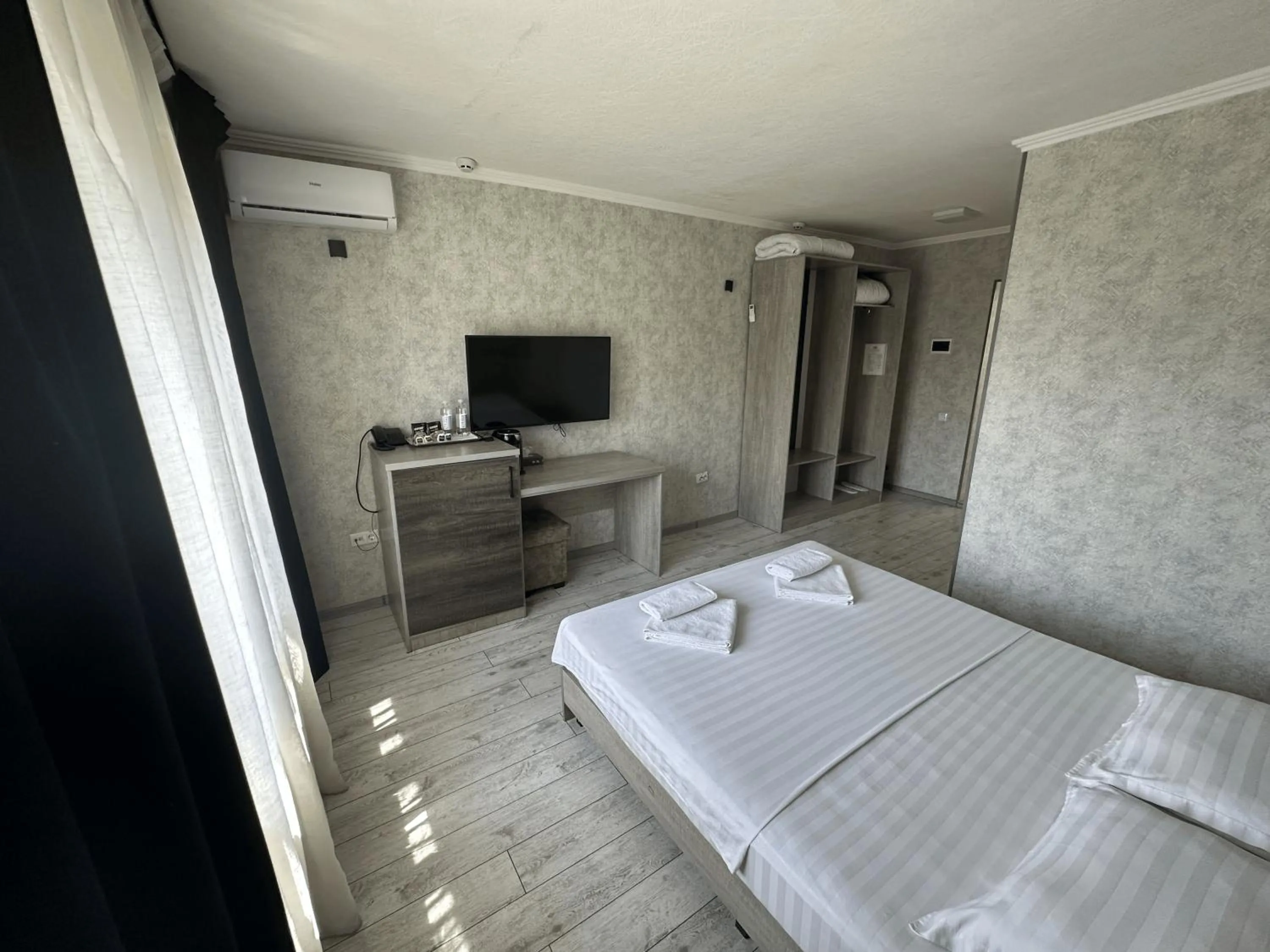 Bed in Artist Regency Hotel