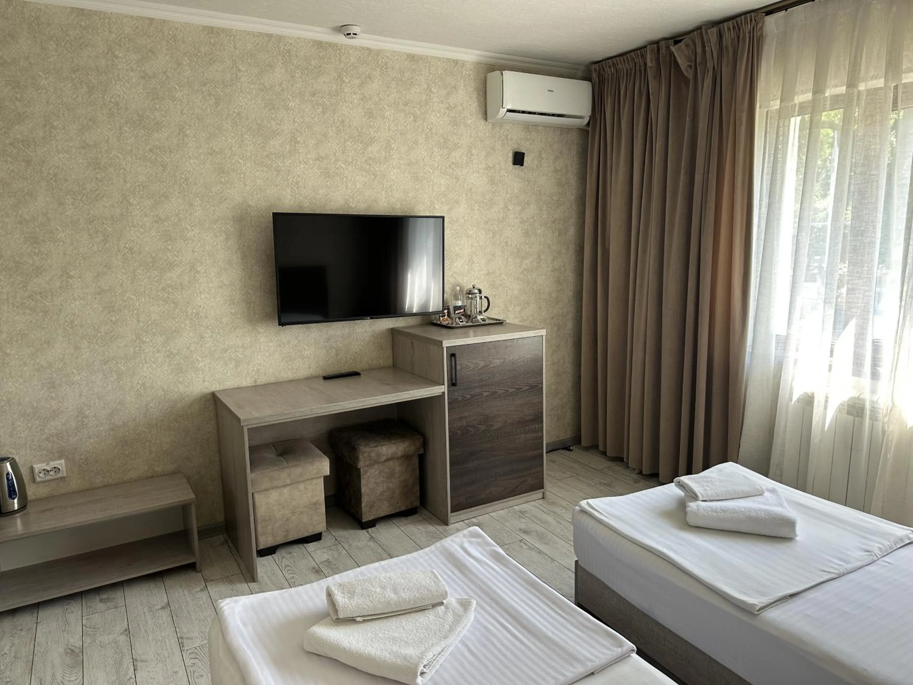 Communal lounge/ TV room in Artist Regency Hotel