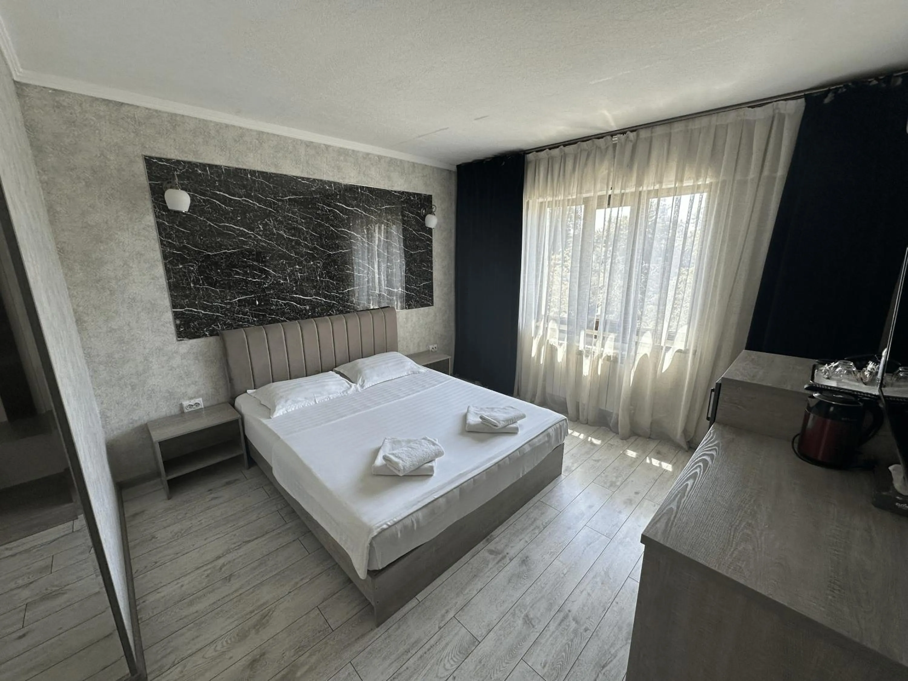 Bed in Artist Regency Hotel