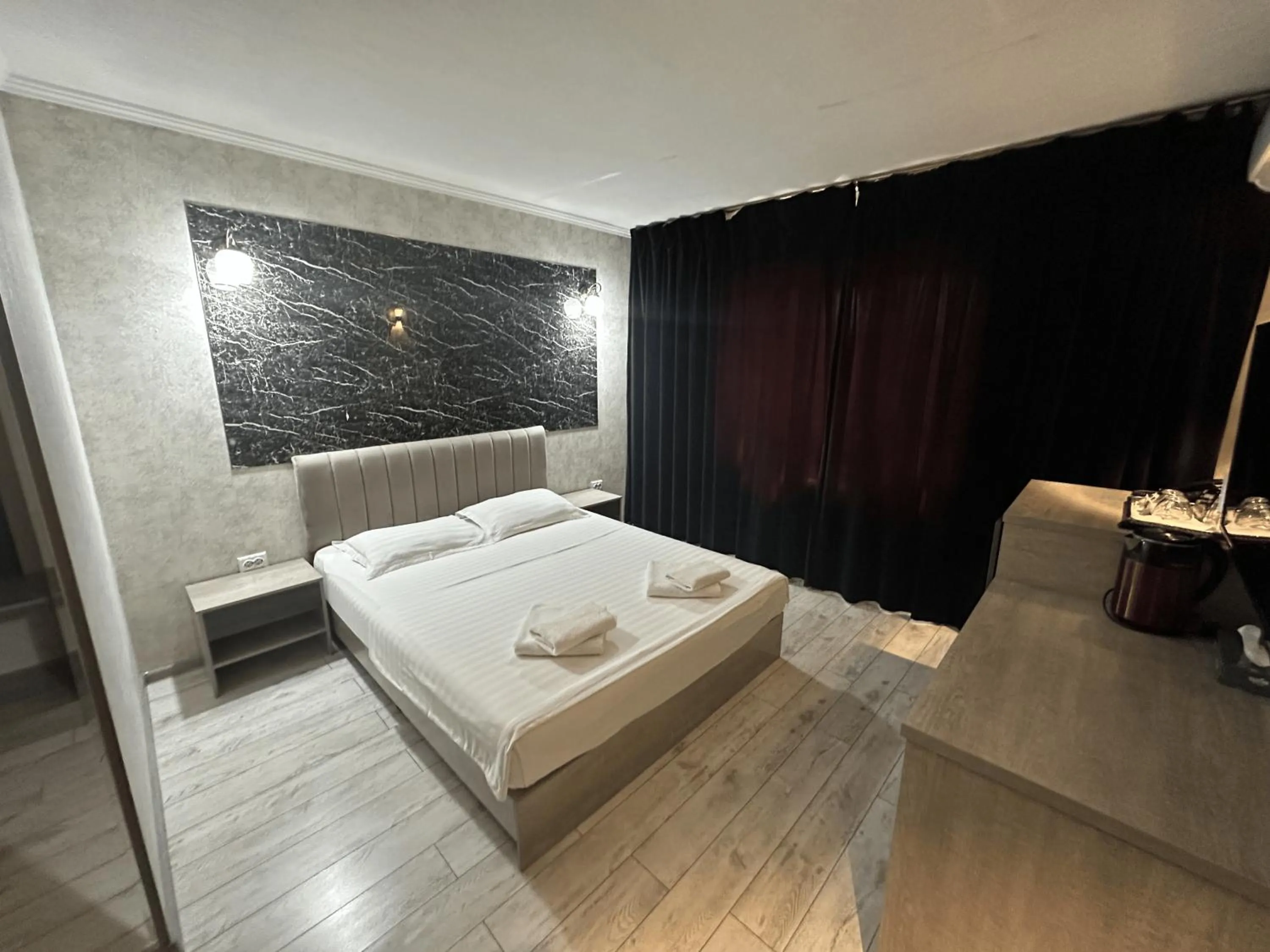 Bed in Artist Regency Hotel