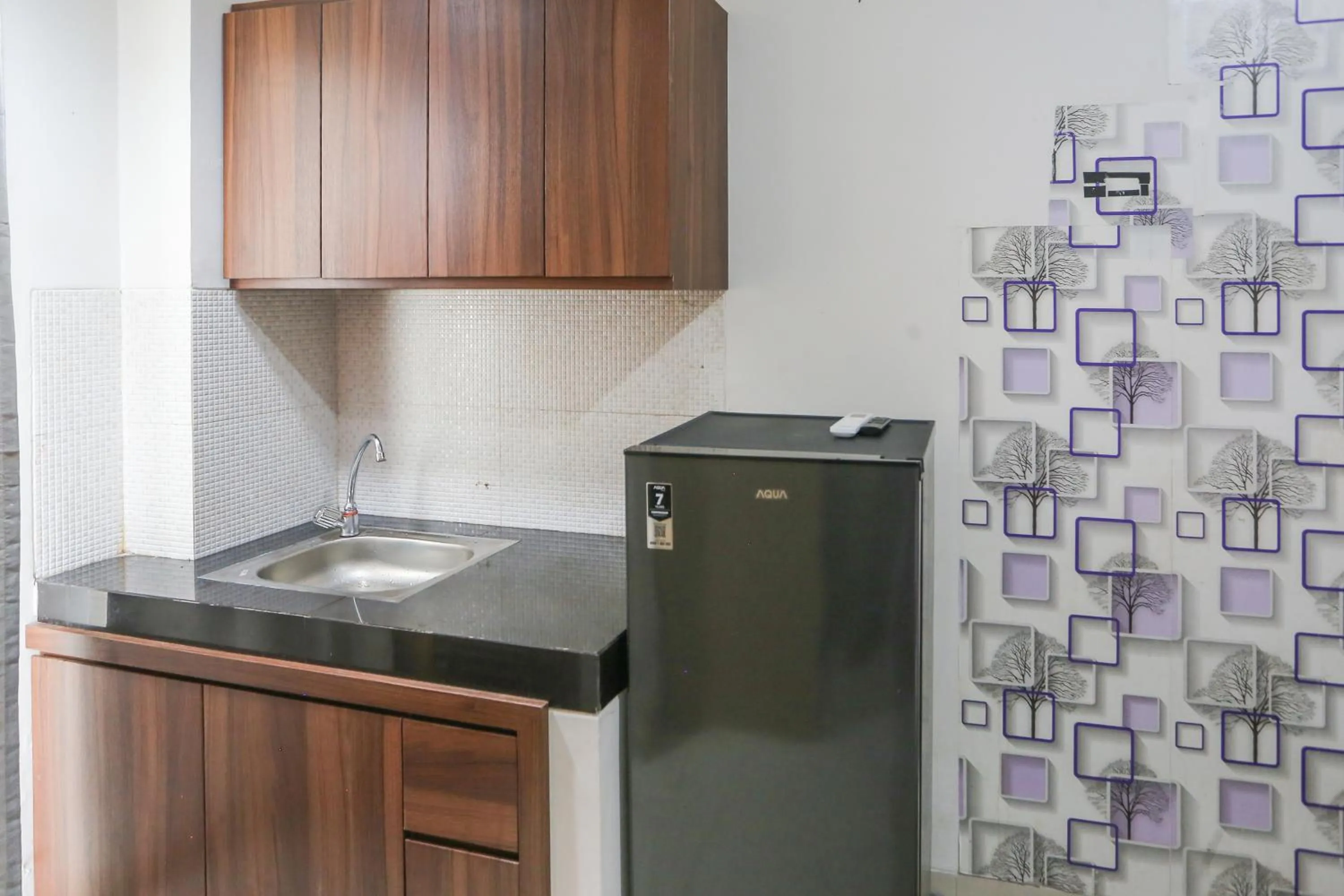 Kitchen or kitchenette in OYO 93948 Bunda Rachma Rooms