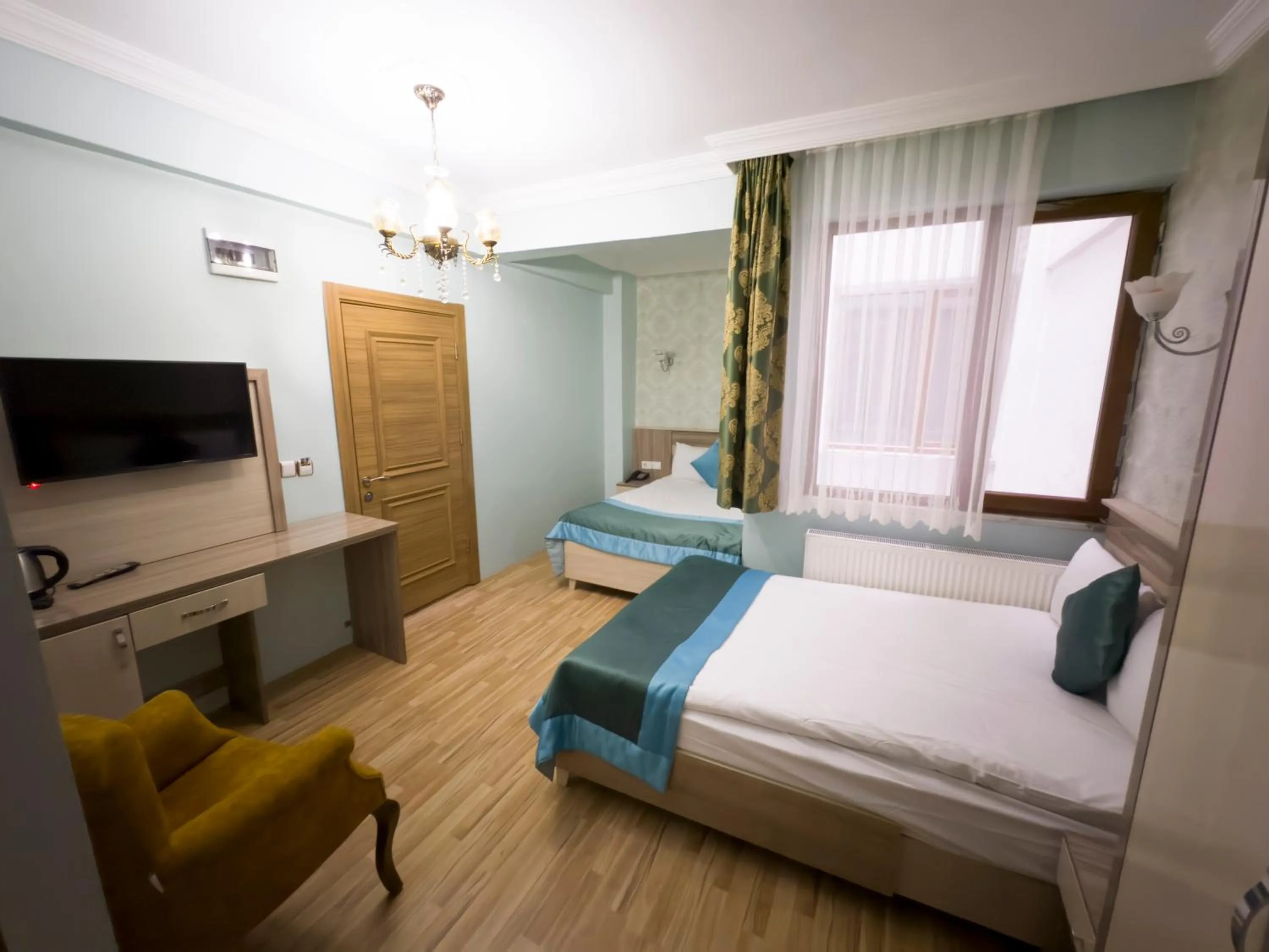 Communal lounge/ TV room, Bed in Kars Center Hotel