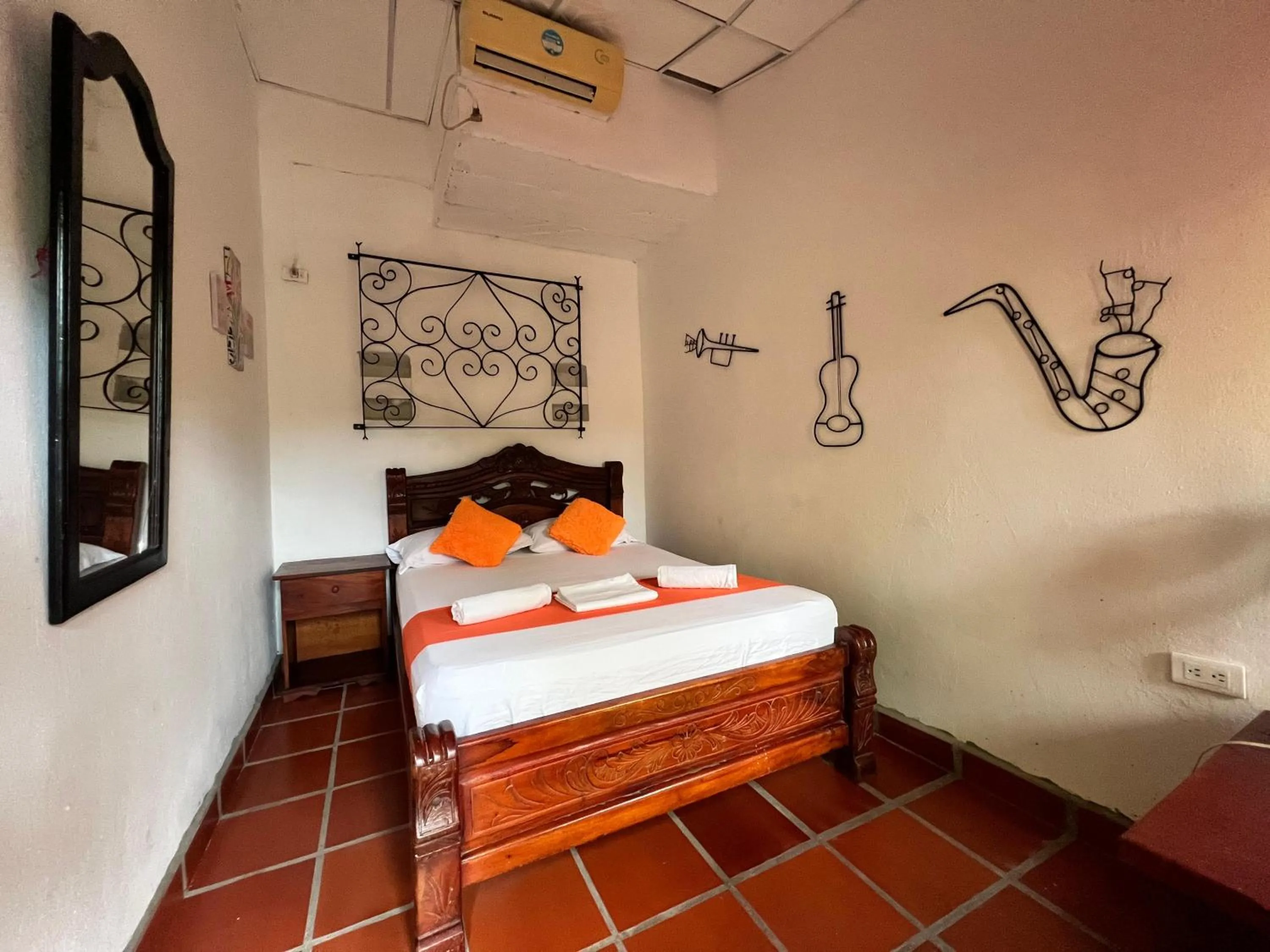 Bed in La Casa del Viajero Mompos