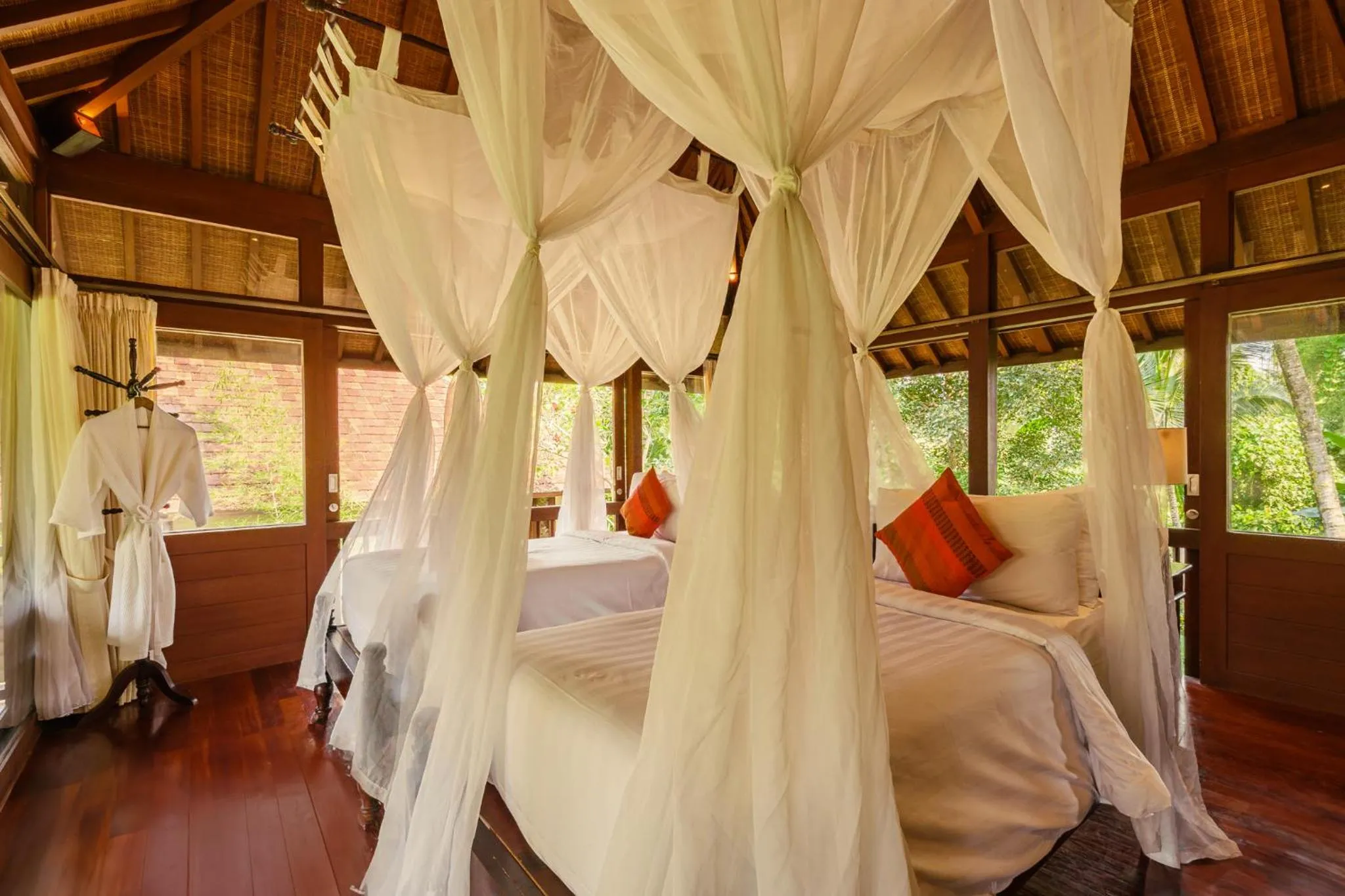 Bed in BeingSattvaa Luxury Ubud