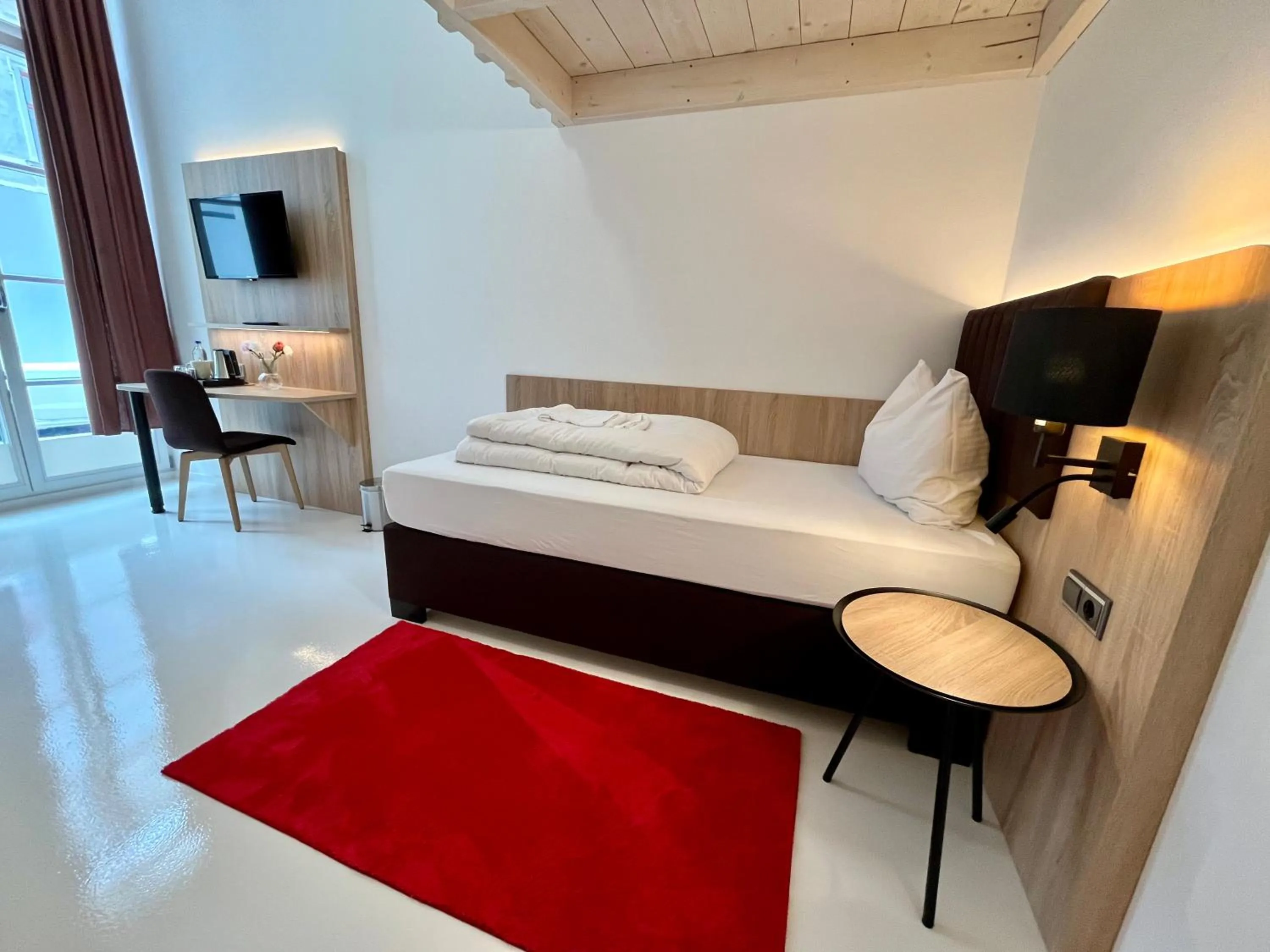 Bed in Adlzreiter City Pension