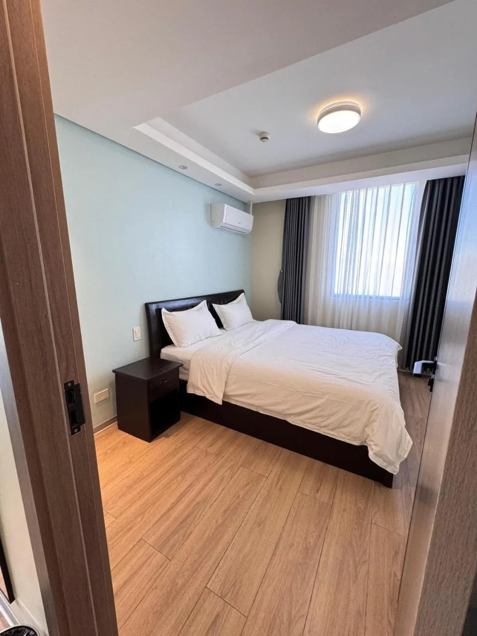 Bed in LCONDOTEL Hotel Studio with Balcony at Imperial Plaza near MOA NAIA PITX