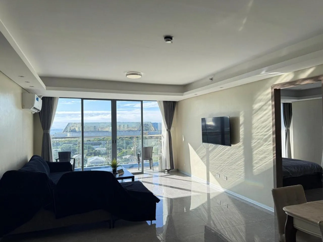 Communal lounge/ TV room in LCONDOTEL Hotel Studio with Balcony at Imperial Plaza near MOA NAIA PITX