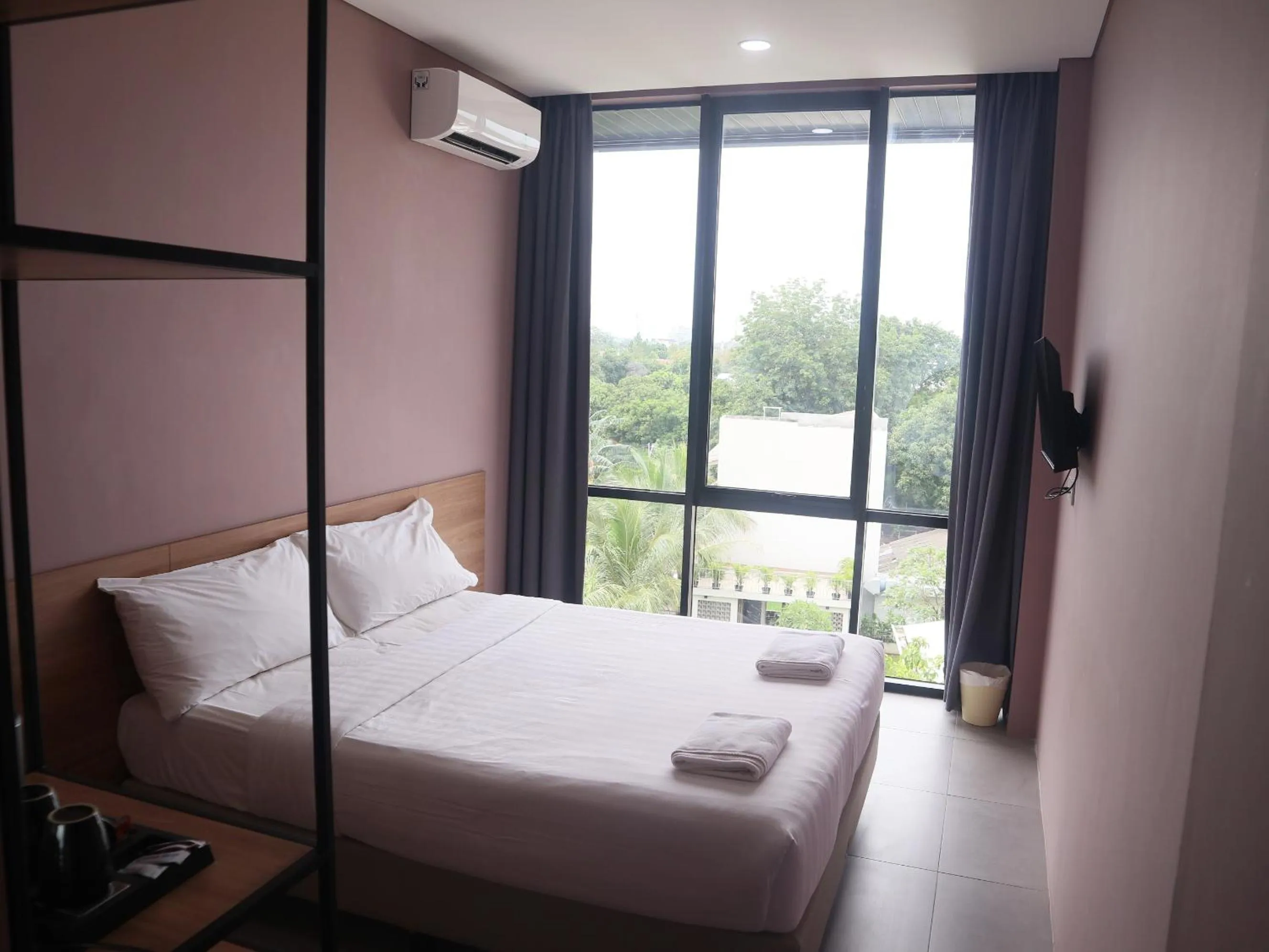 Bed in VNC Alam Sutera Hotel Powered by Archipelago