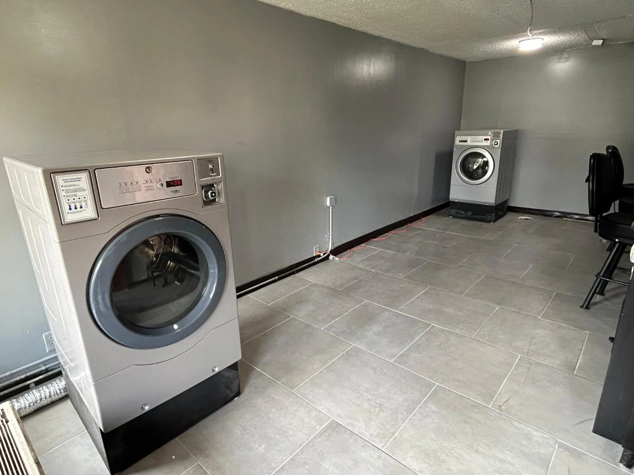 laundry in HomeTowne Studios by Red Roof Montgomery - Midtown