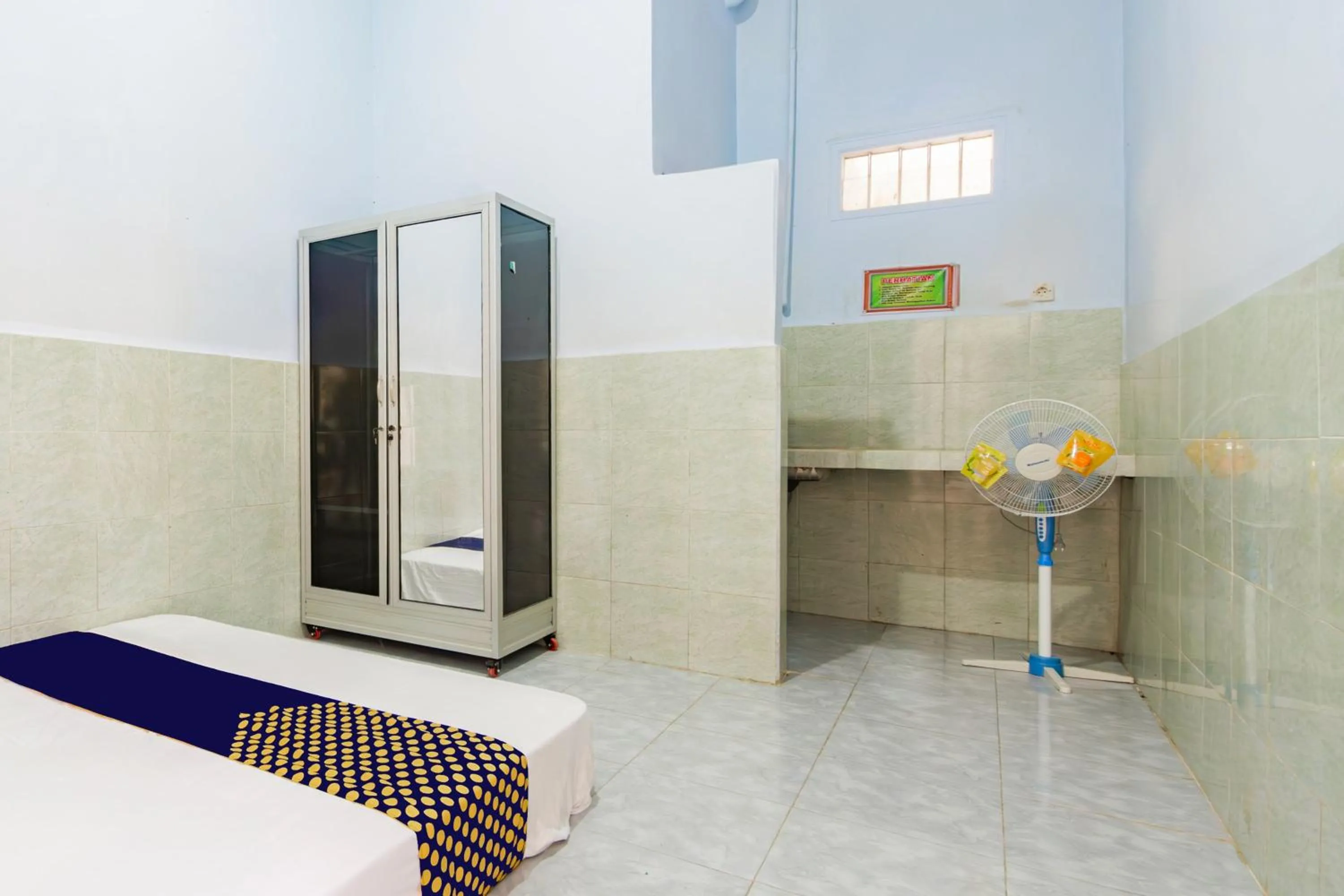 Bedroom in SPOT ON 93965 Ibrahim Guest House Syariah