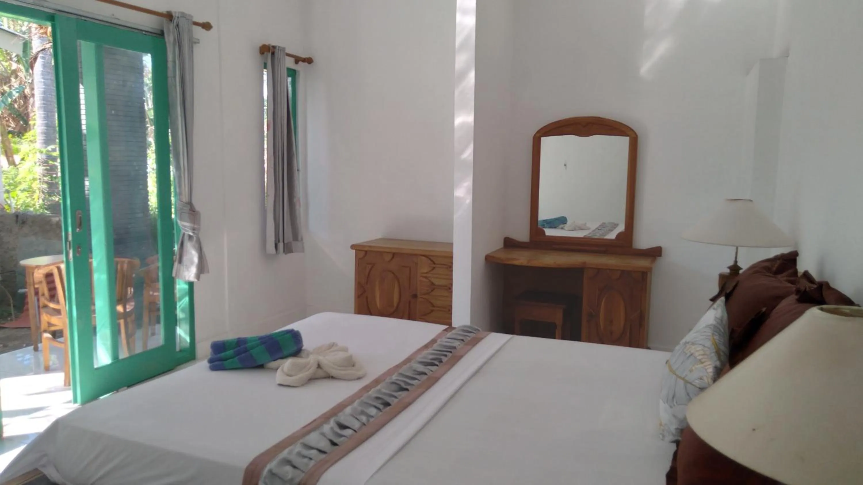 Bed in Palm Trees Villas