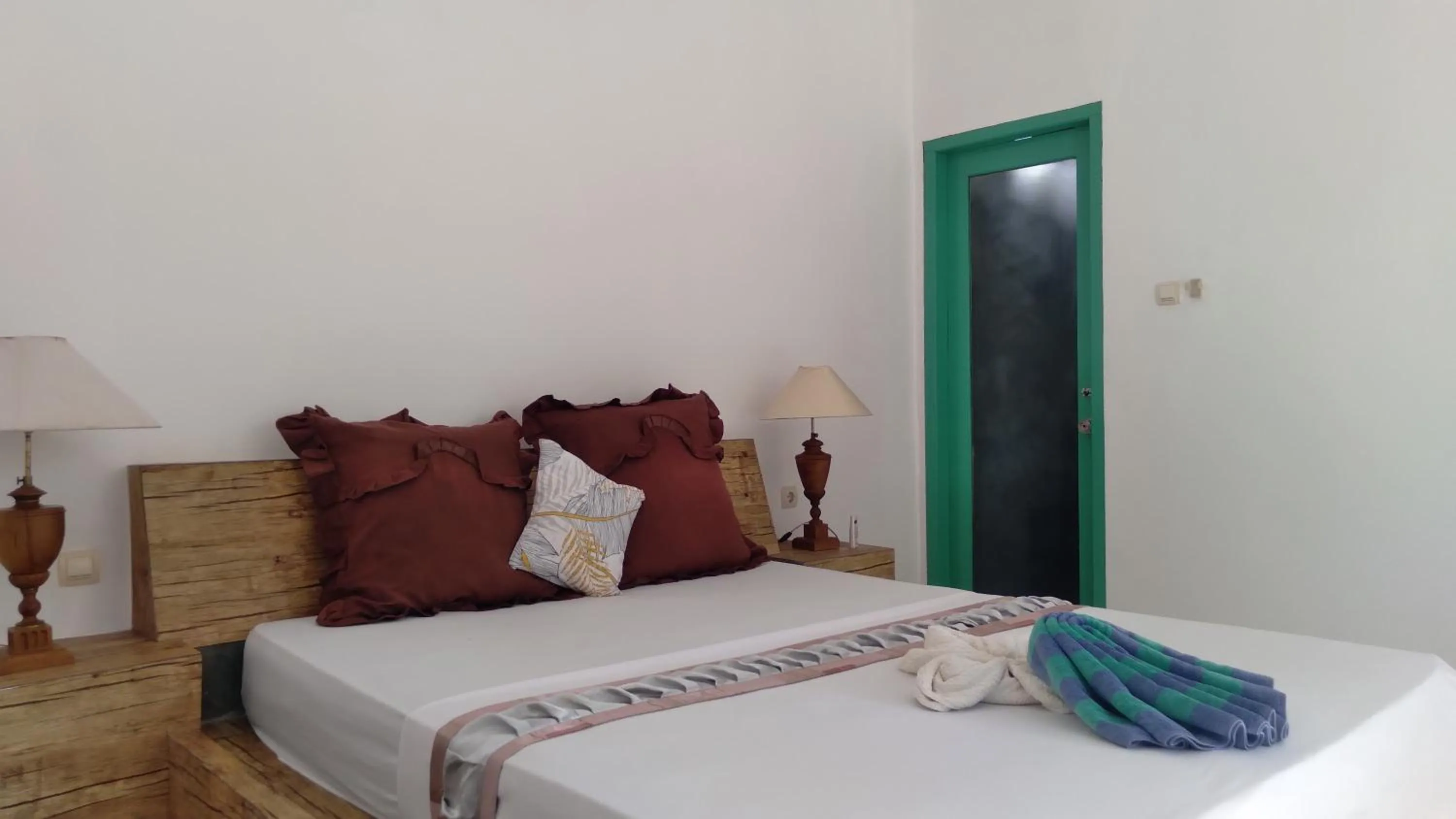 Bed in Palm Trees Villas