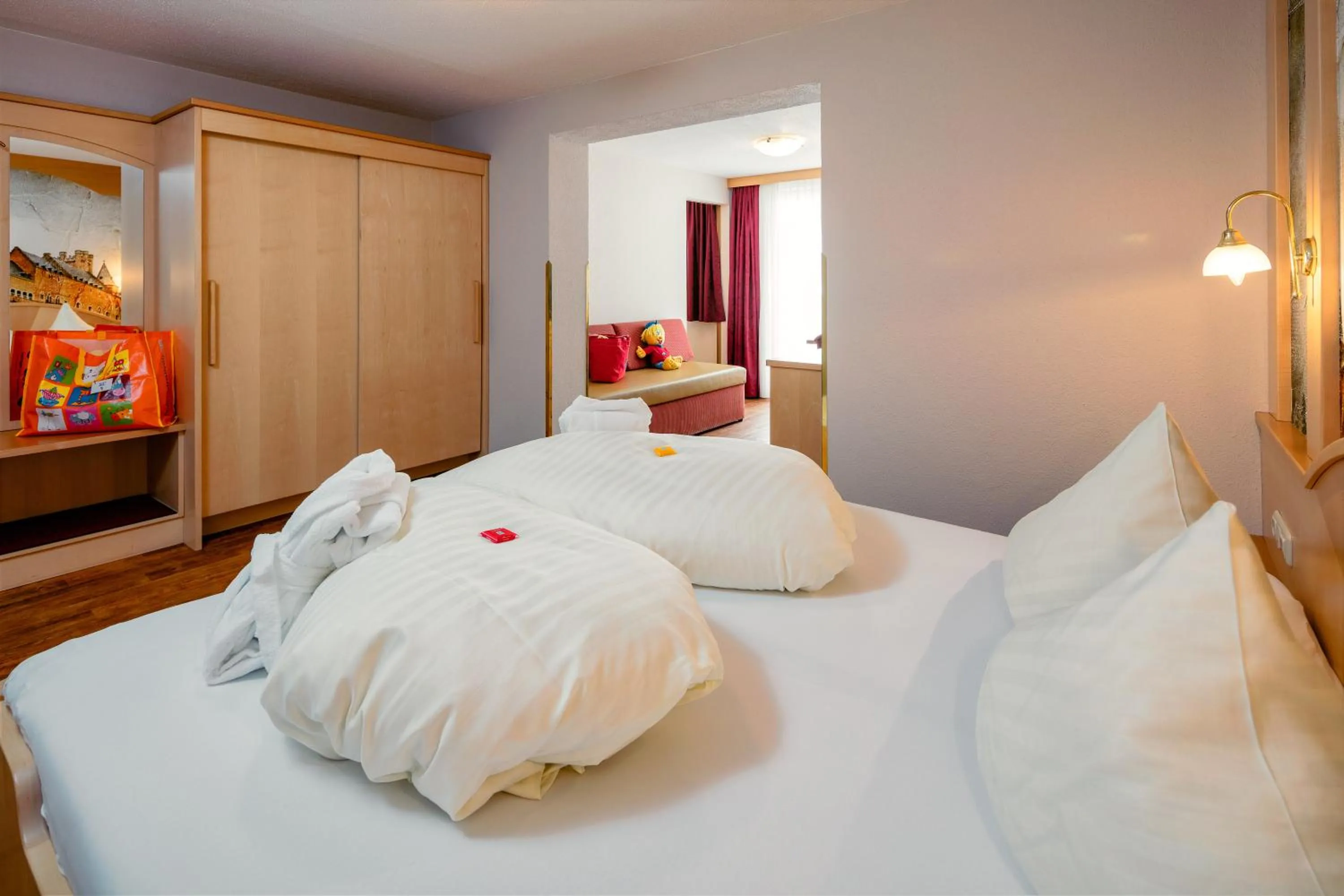 Seating area, Bed in Kinderhotel Laderhof