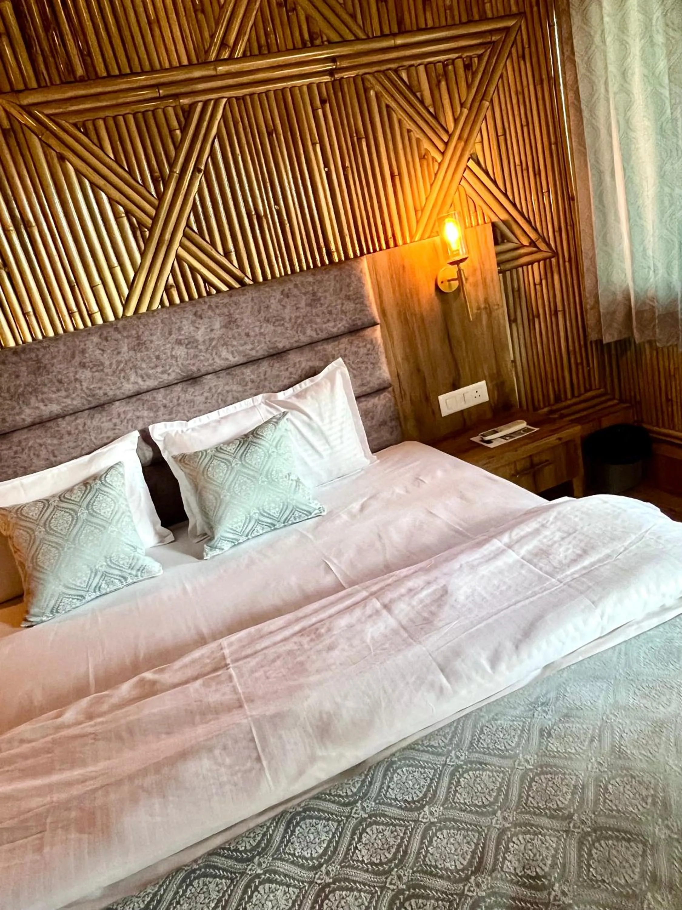 Bed in Bamboo Garden Cottages and Cafe