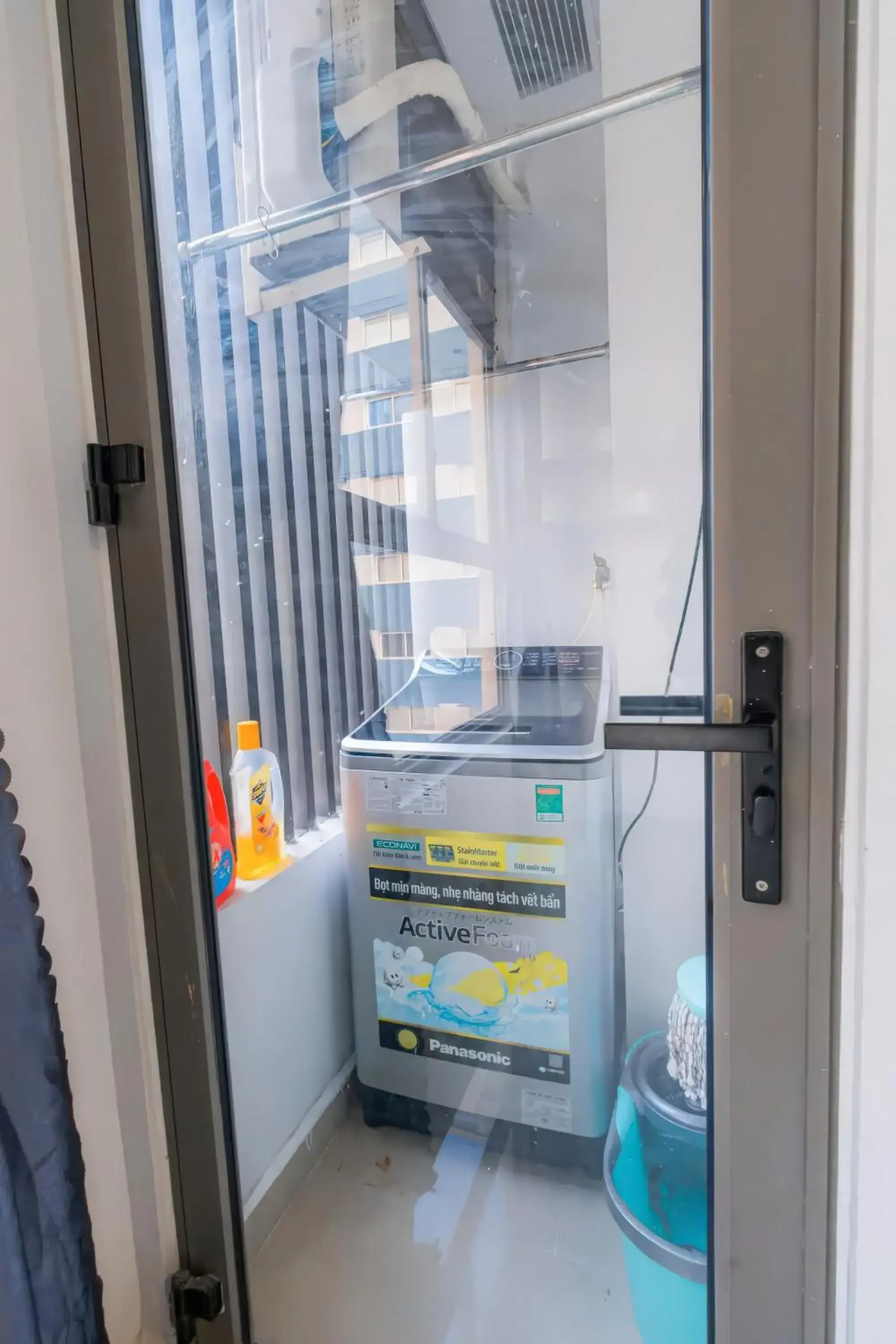 washing machine in Minute Suites - Botanica Orchard TSN Airport washing machine in Minute Suites - Botanica Orchard TSN Airport