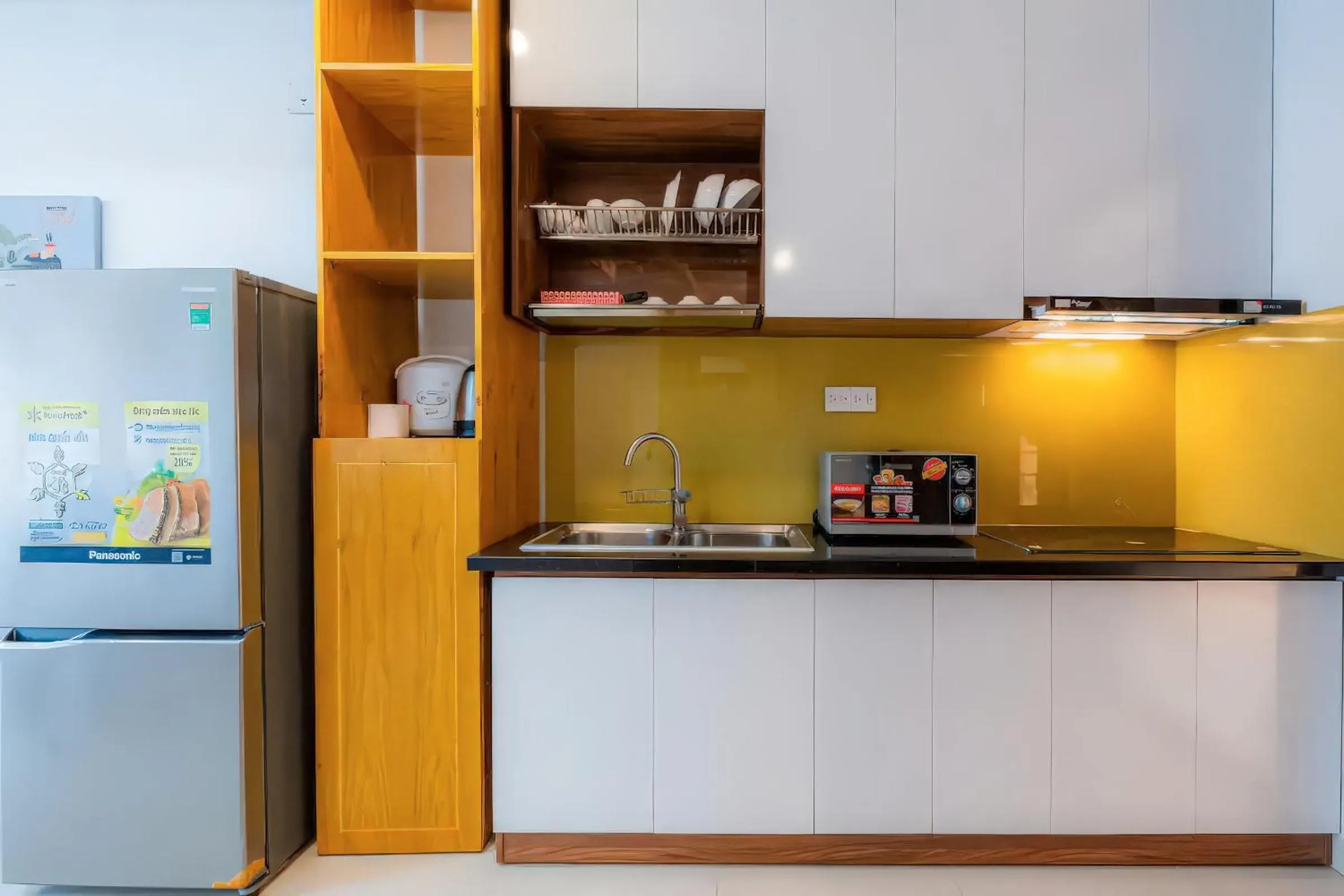 Kitchen or kitchenette in Minute Suites - Botanica Orchard TSN Airport