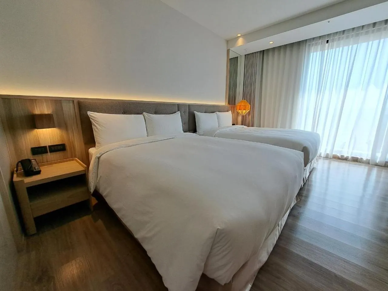 Bed in Boutech Wuri Village Hotel