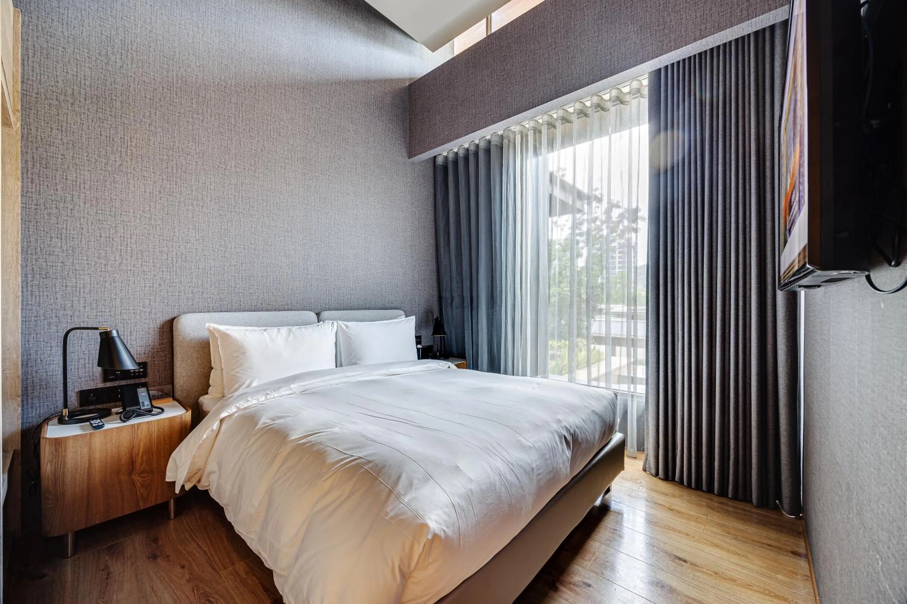 Bed in Boutech Wuri Village Hotel