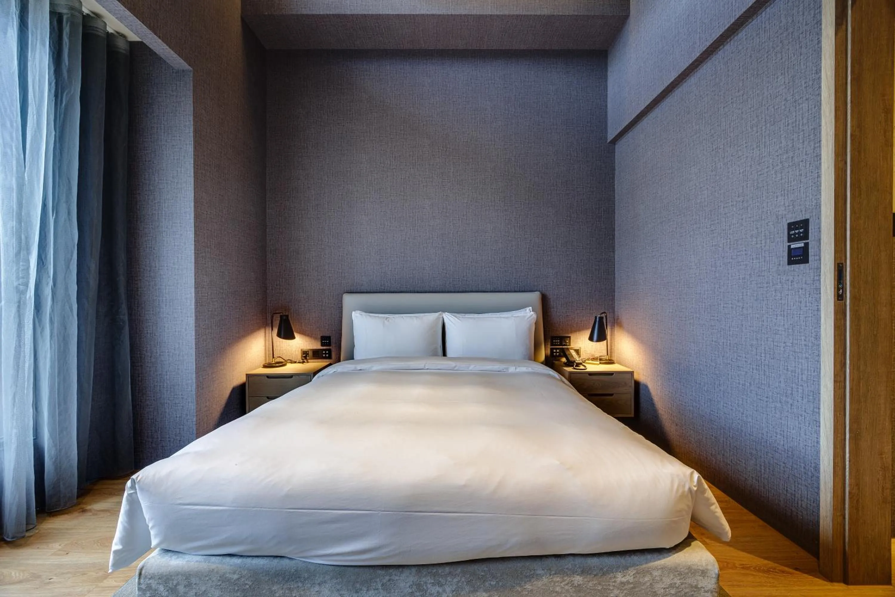 Bed in Boutech Wuri Village Hotel