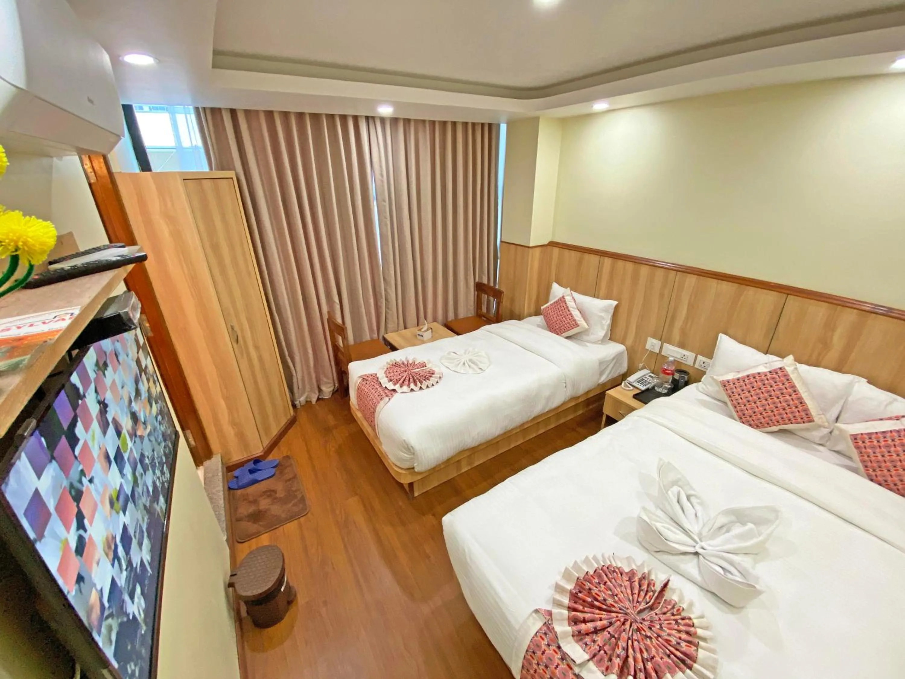 Communal lounge/ TV room, Bed in Hotel Lumbini Airport