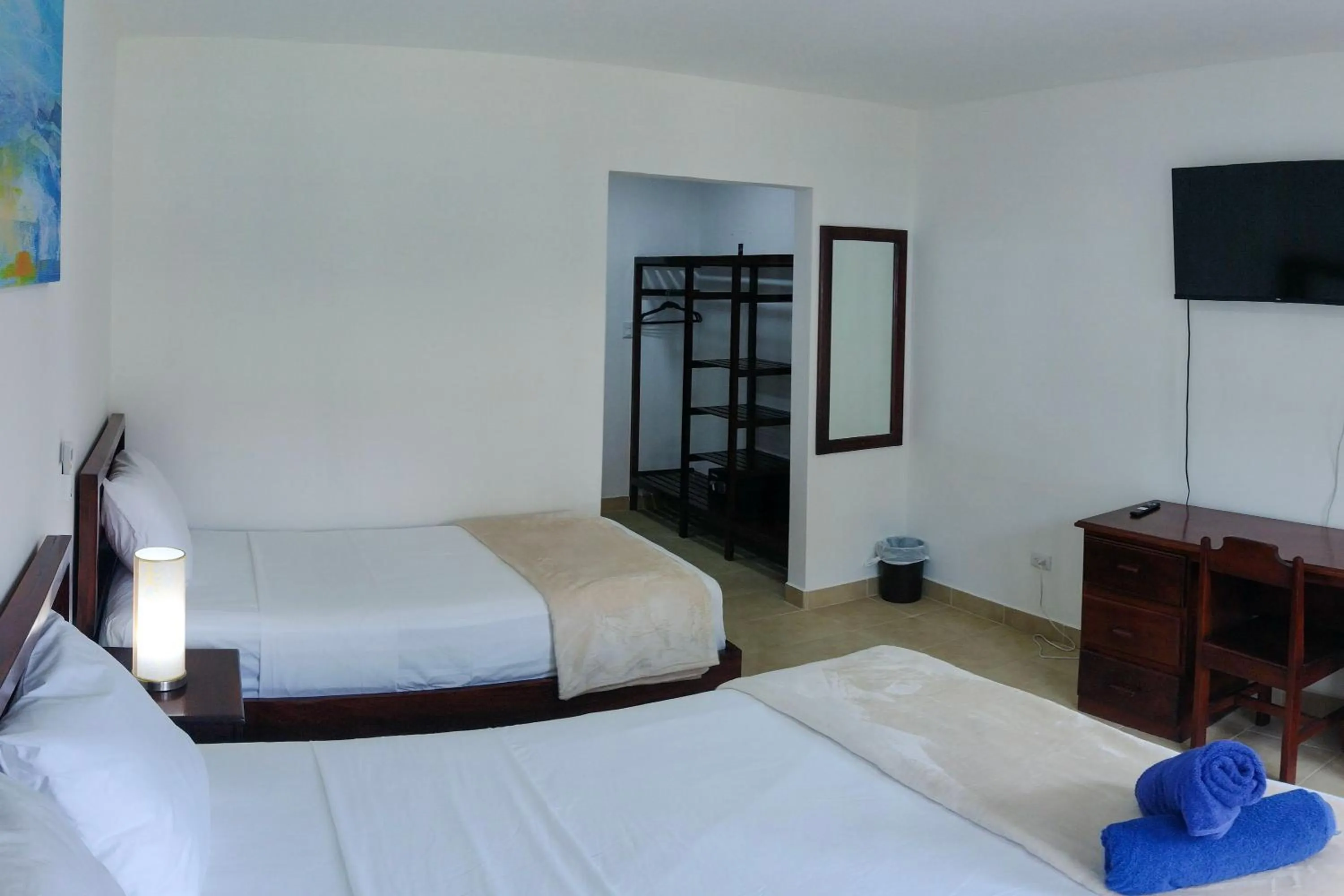 Bed in Fuego del Sol Beachfront Hotel