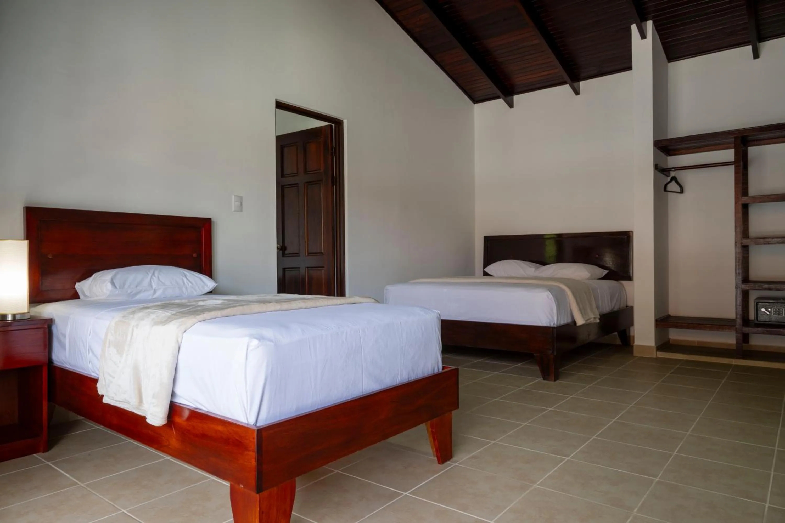 Bedroom, Bed in Fuego del Sol Beachfront Hotel