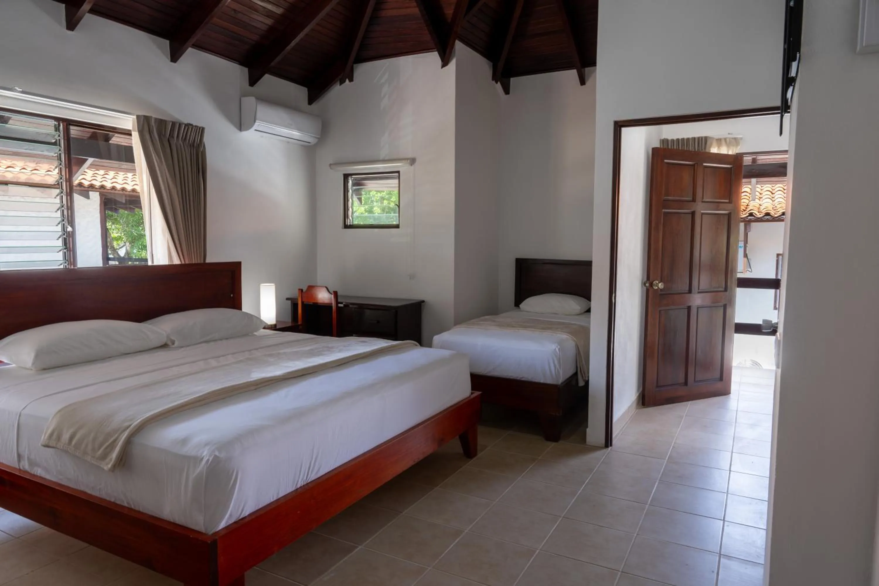 Photo of the whole room, Bed in Fuego del Sol Beachfront Hotel