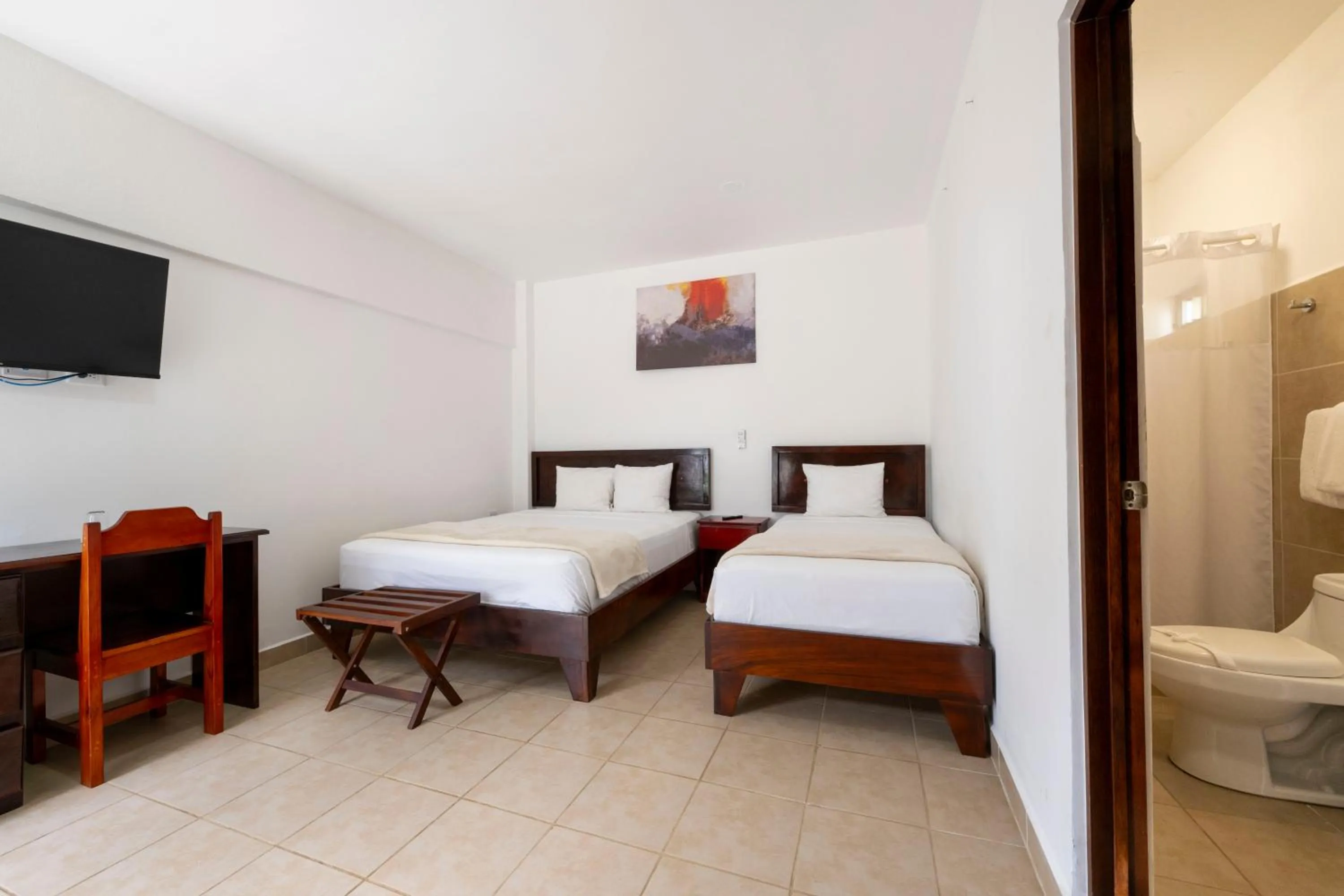 Bed in Fuego del Sol Beachfront Hotel