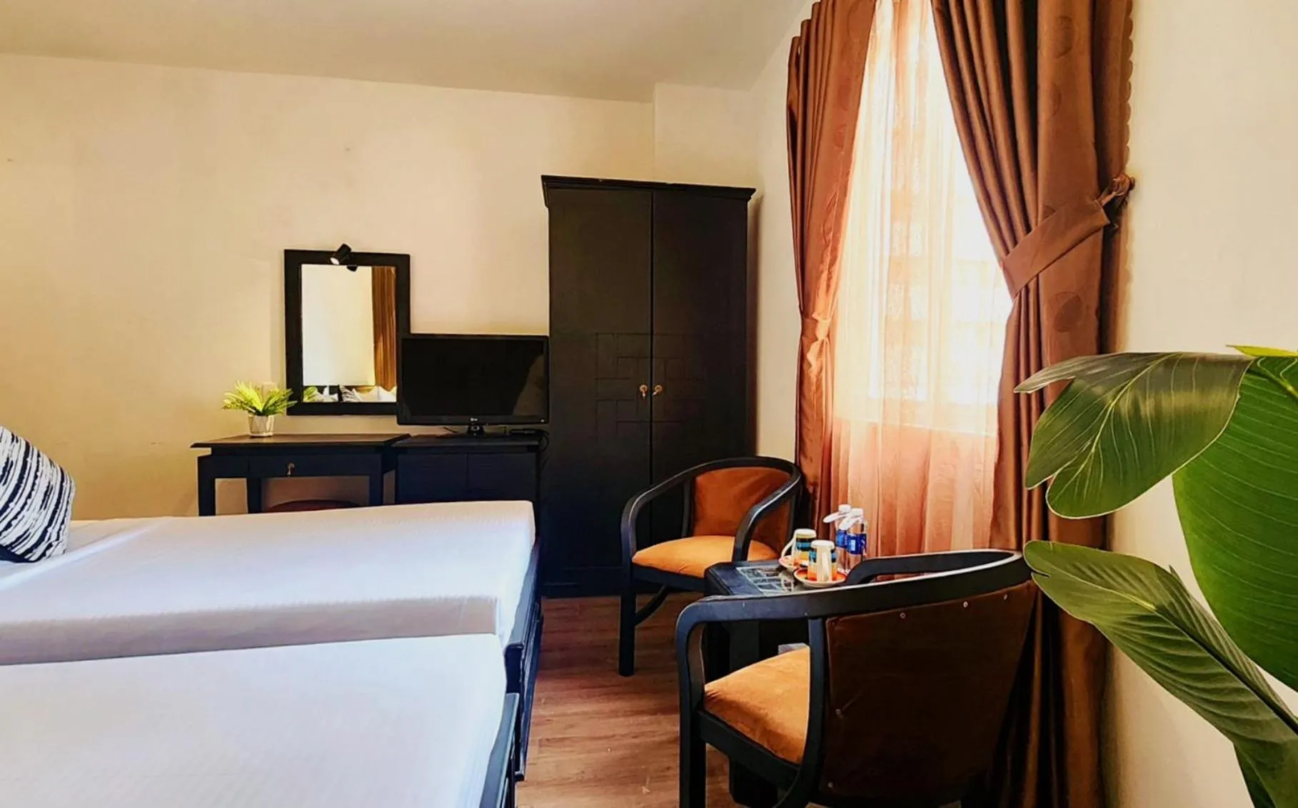 Bed in Rosa May Hotel