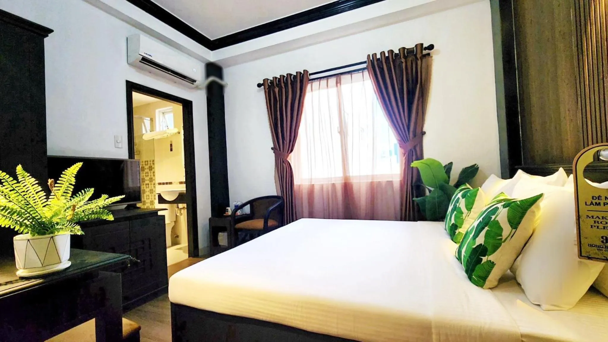 Bed in Rosa May Hotel