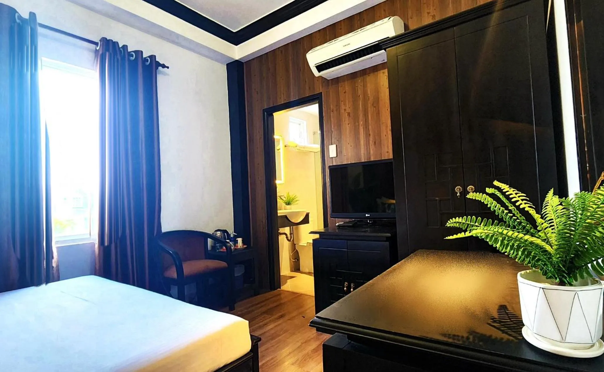 Bed in Rosa May Hotel