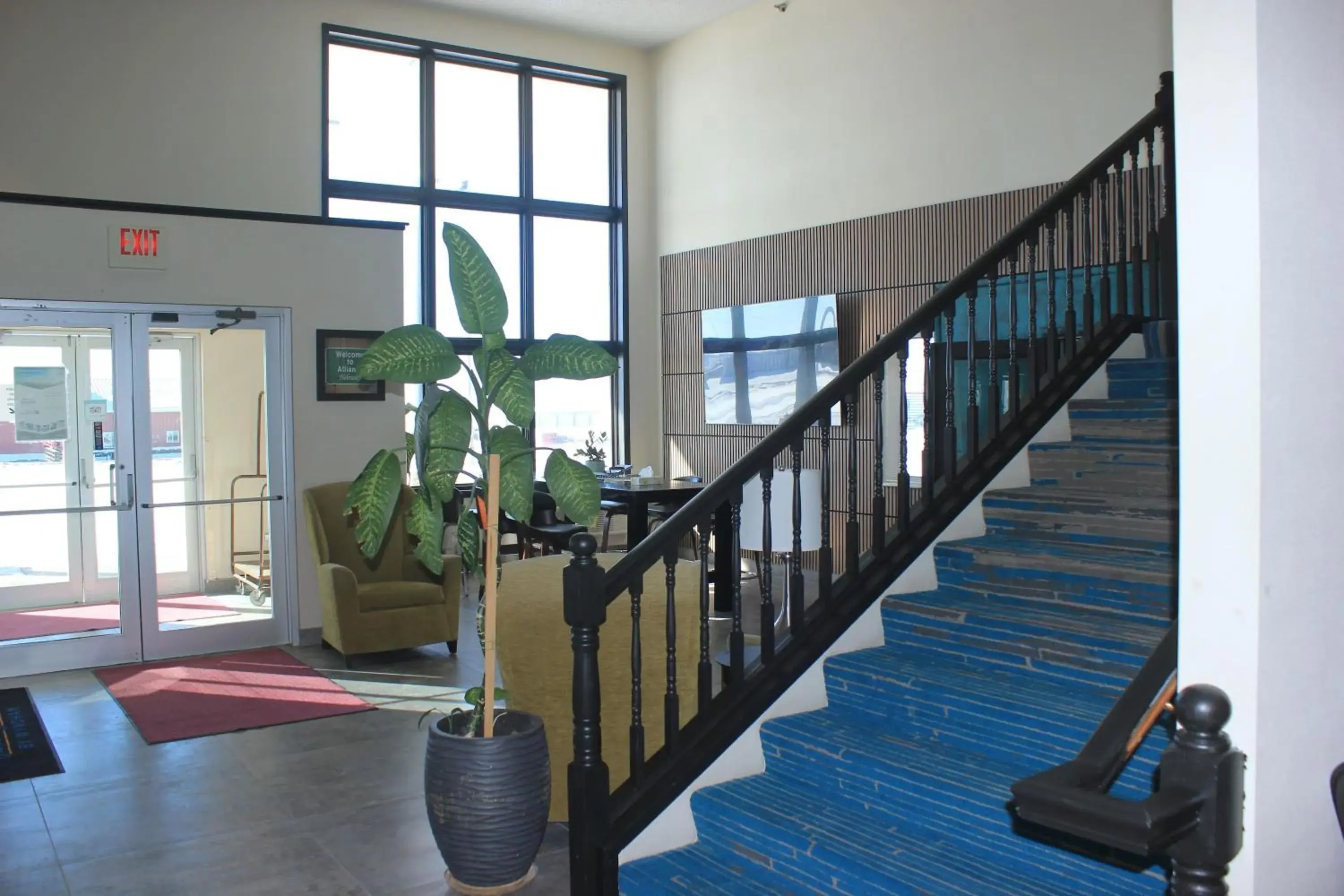 Lobby or reception in Alliance Hotel & Suites, a Howard Johnson by Wyndham Lobby or reception in Alliance Hotel & Suites, a Howard Johnson by Wyndham