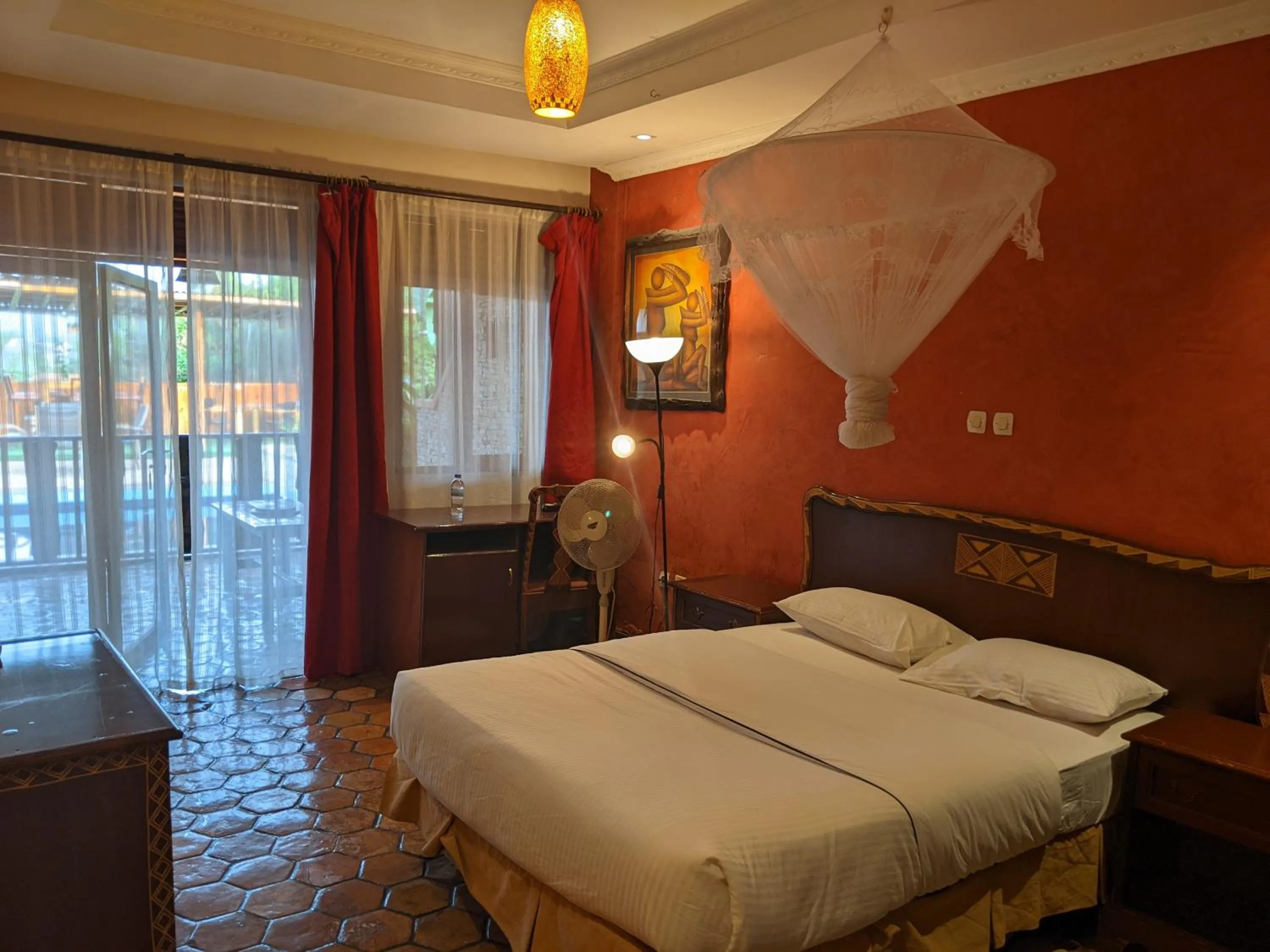 Communal lounge/ TV room, Bed in Inside Afrika Boutique Hotel