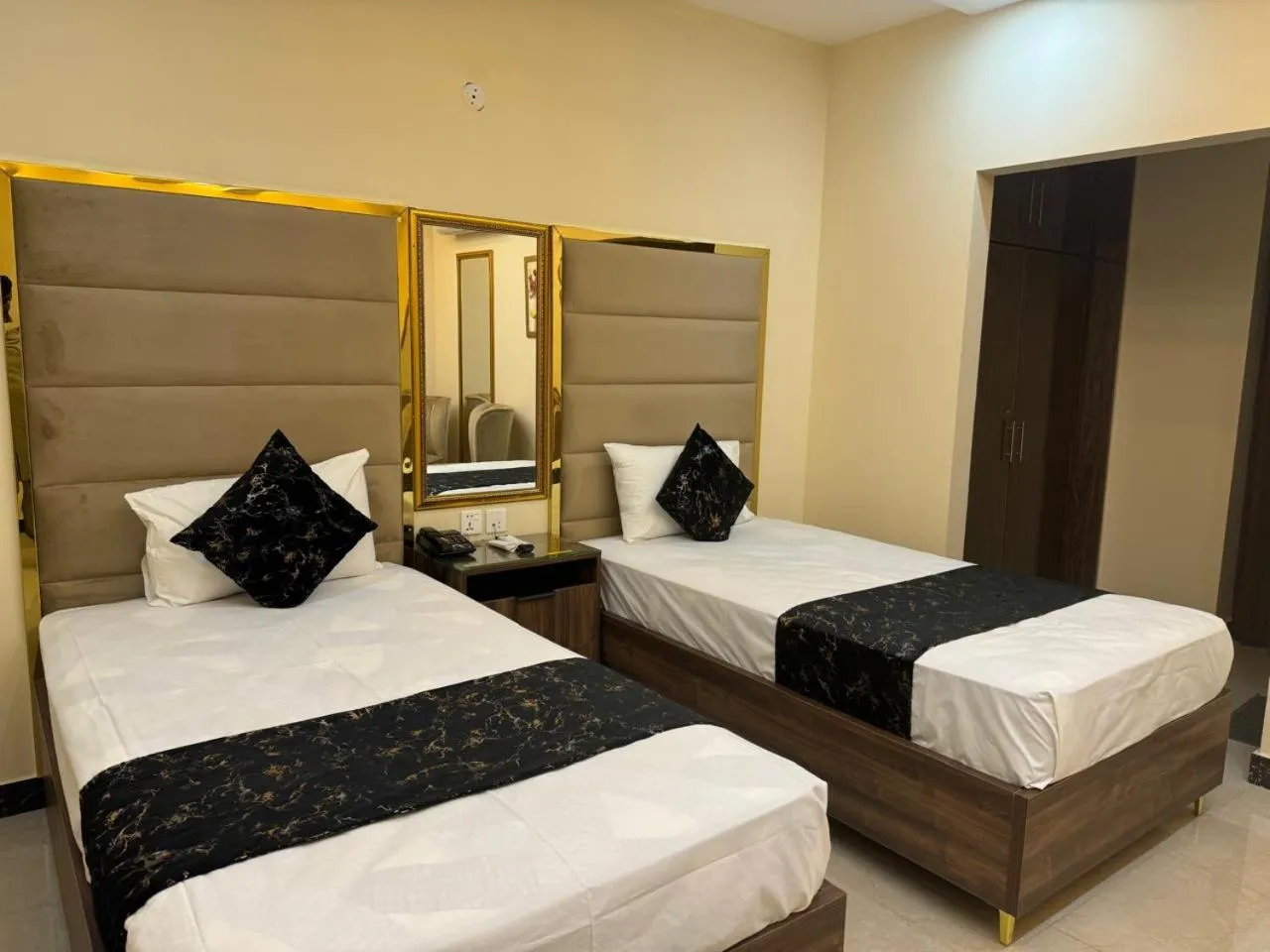 Bed in Gold Pine Hotel Lahore