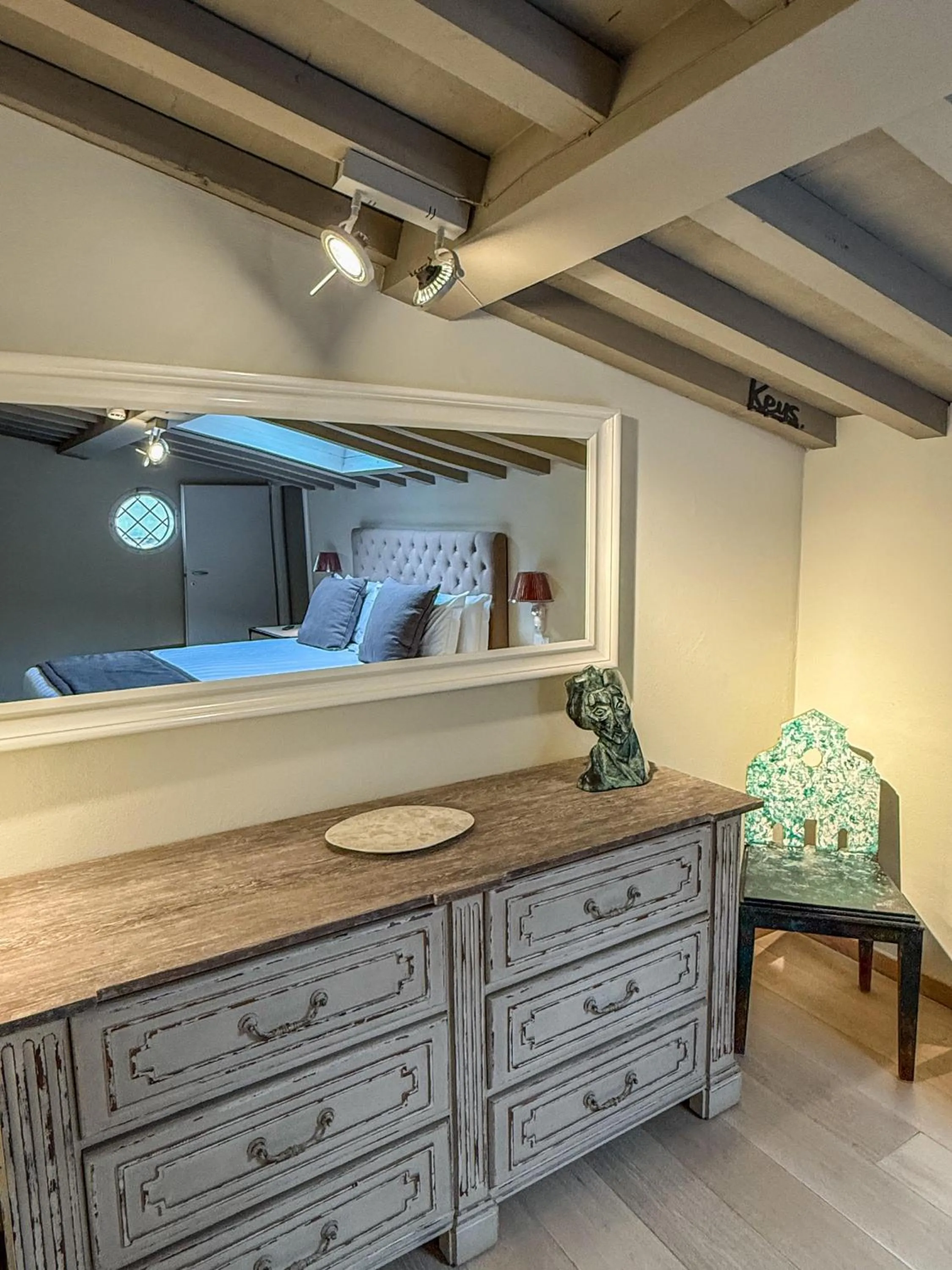 Decorative detail, Bed in Florence Art Apartments