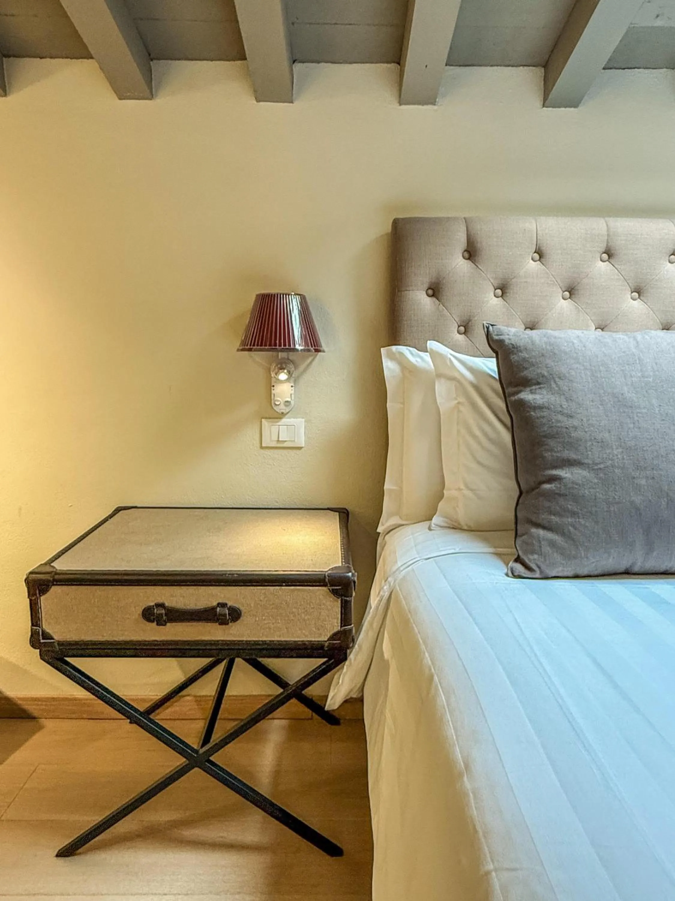 Decorative detail, Bed in Florence Art Apartments