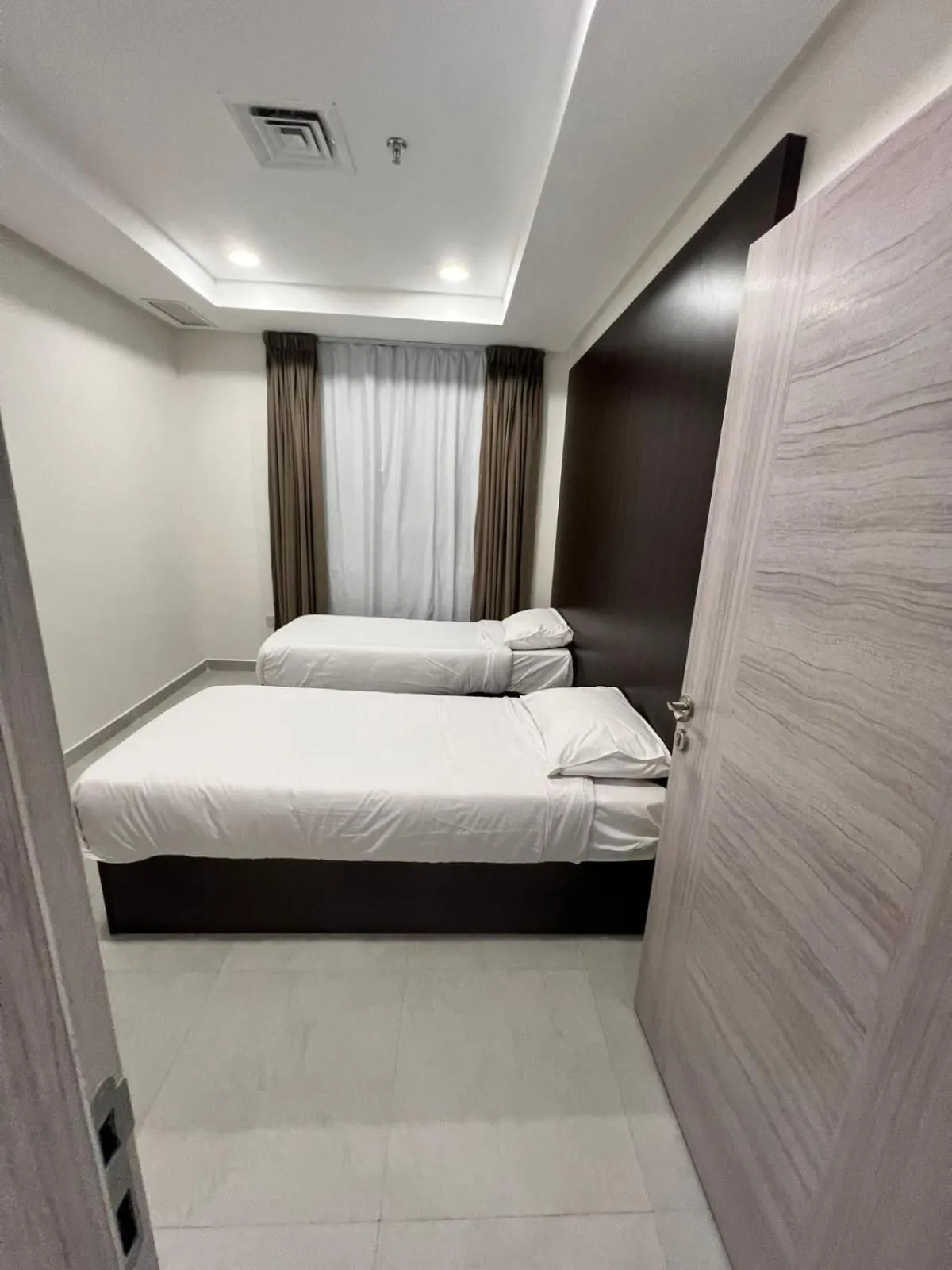 Bed in برج ماجيك سويت Magic Suite Tower