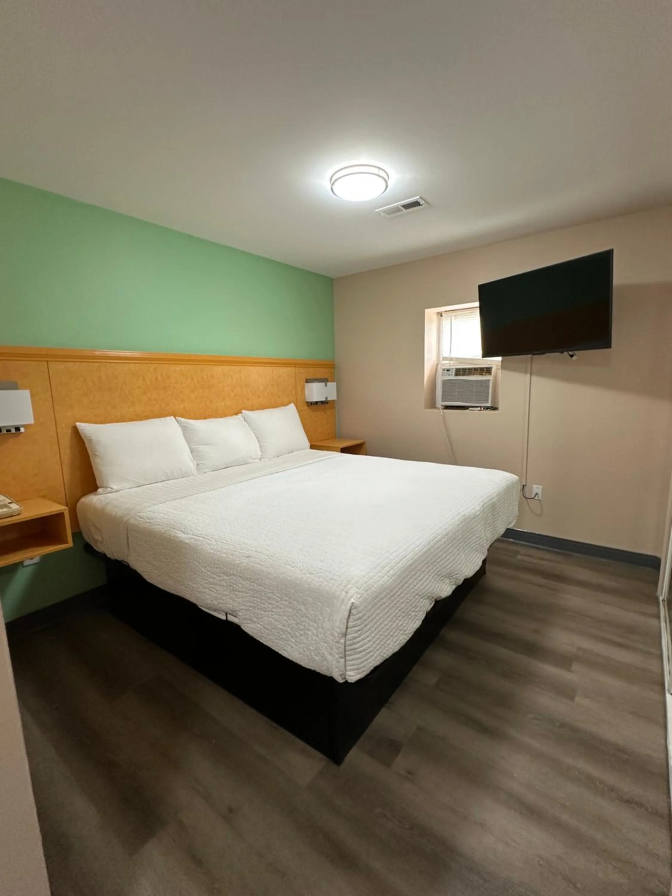 Bed in Security Inn and Suites