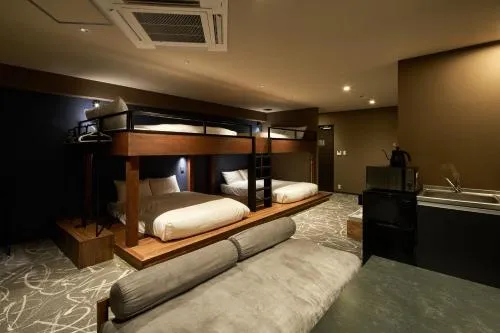 Photo of the whole room, Bed in B/C HOTEL NAHA Hotel with Rental Car