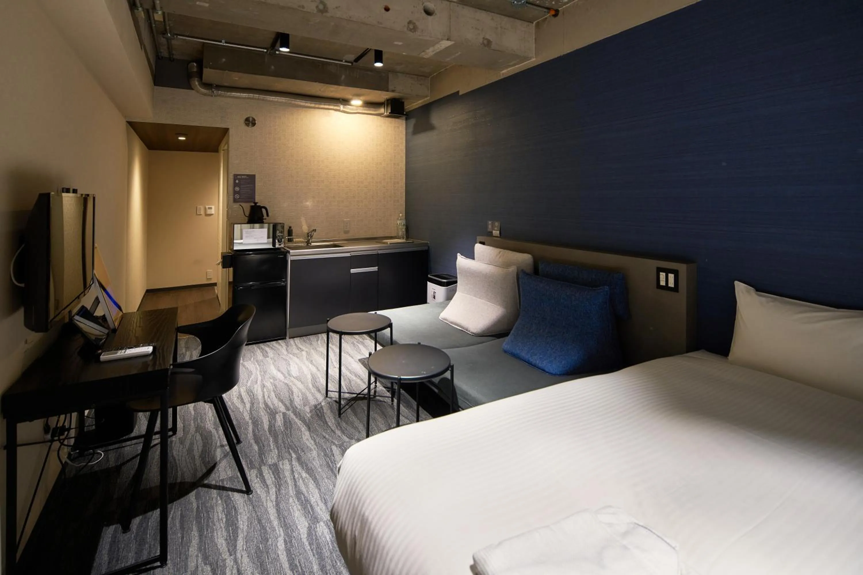 Photo of the whole room, Bed in B/C HOTEL NAHA Hotel with Rental Car