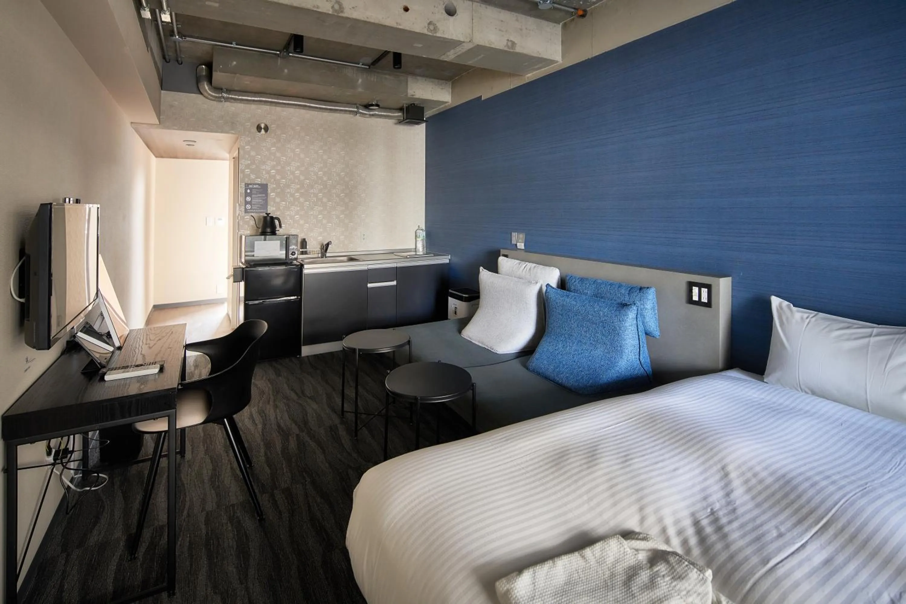 Seating area, Bed in B/C HOTEL NAHA Hotel with Rental Car