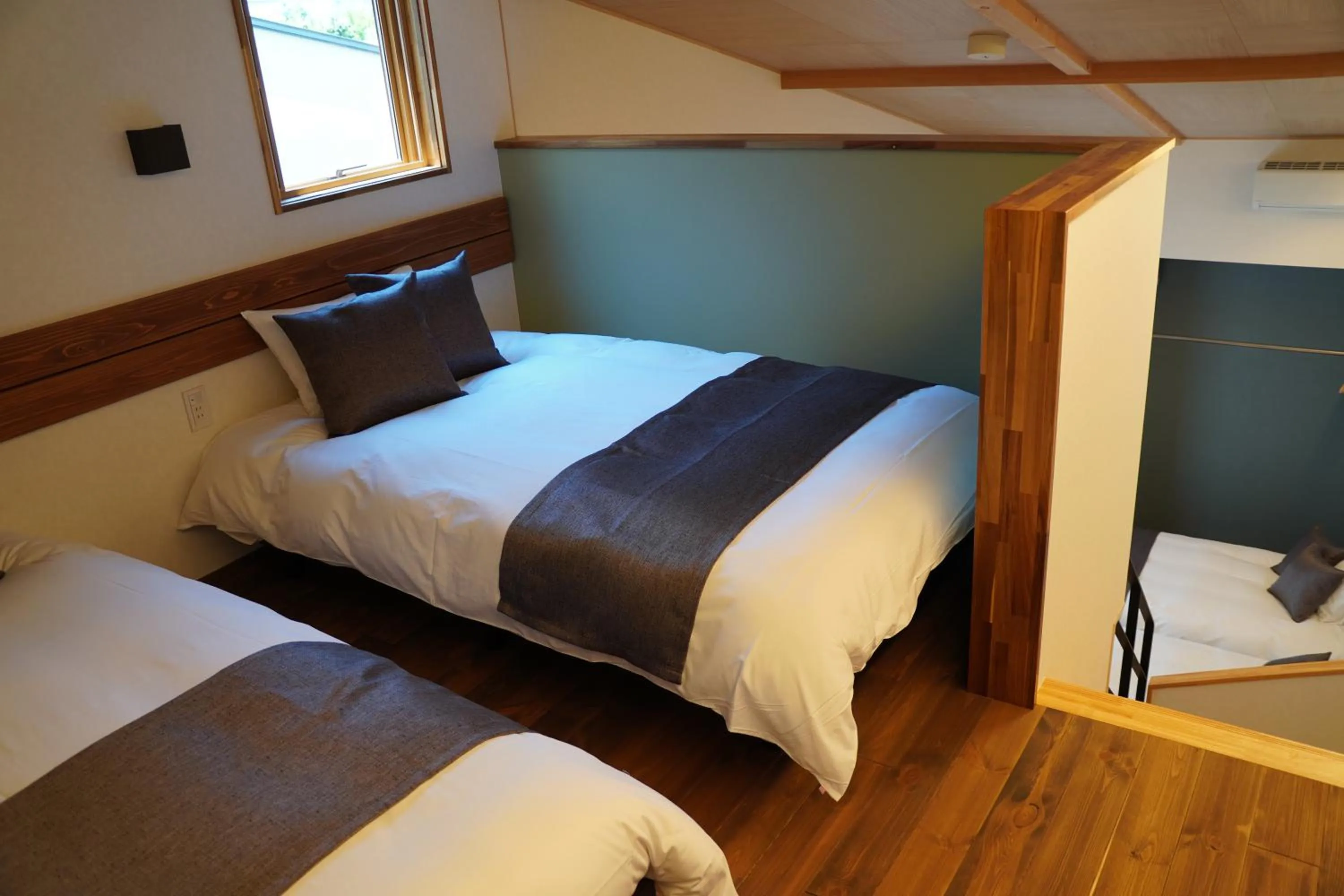 Bed in SAUNA VILLA 然