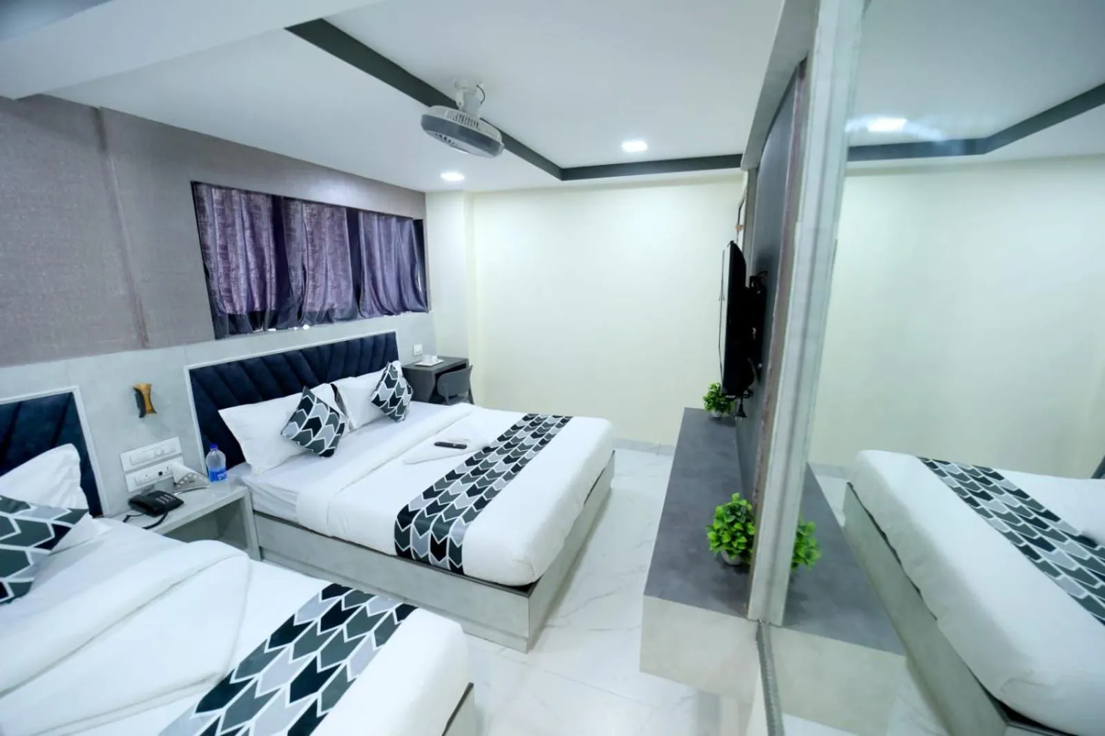 Photo of the whole room, Bed in N.M. Hotel