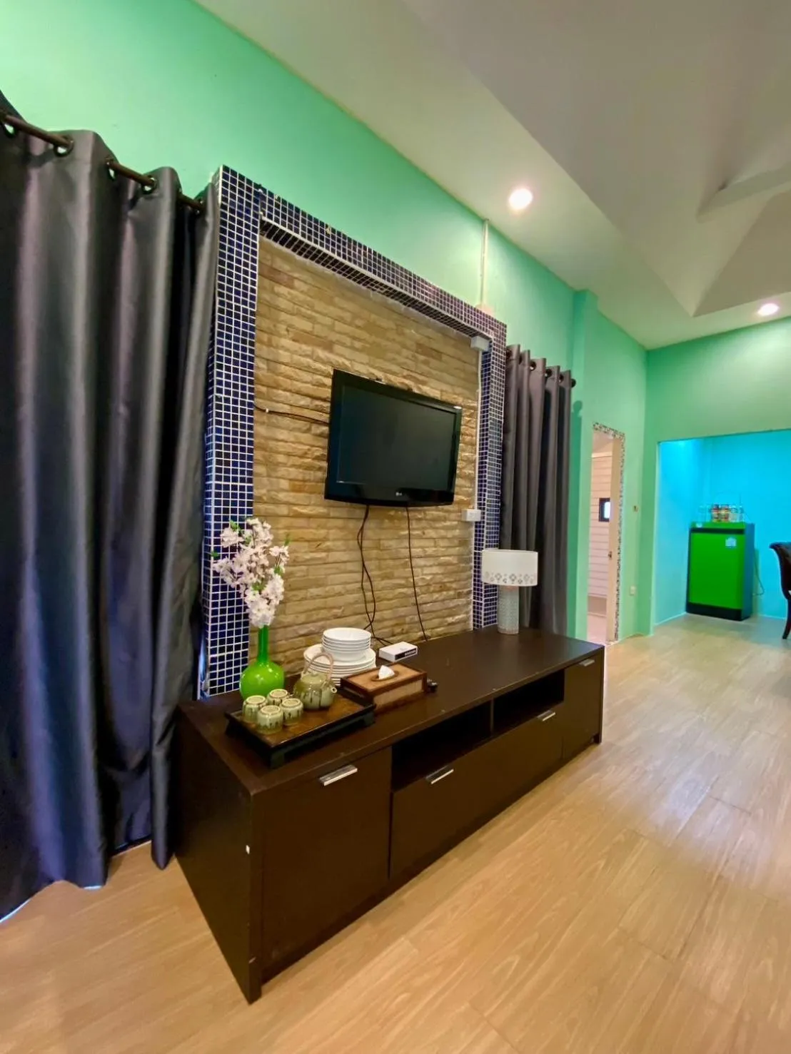 Communal lounge/ TV room in Phalaburi resort by dreamhouse