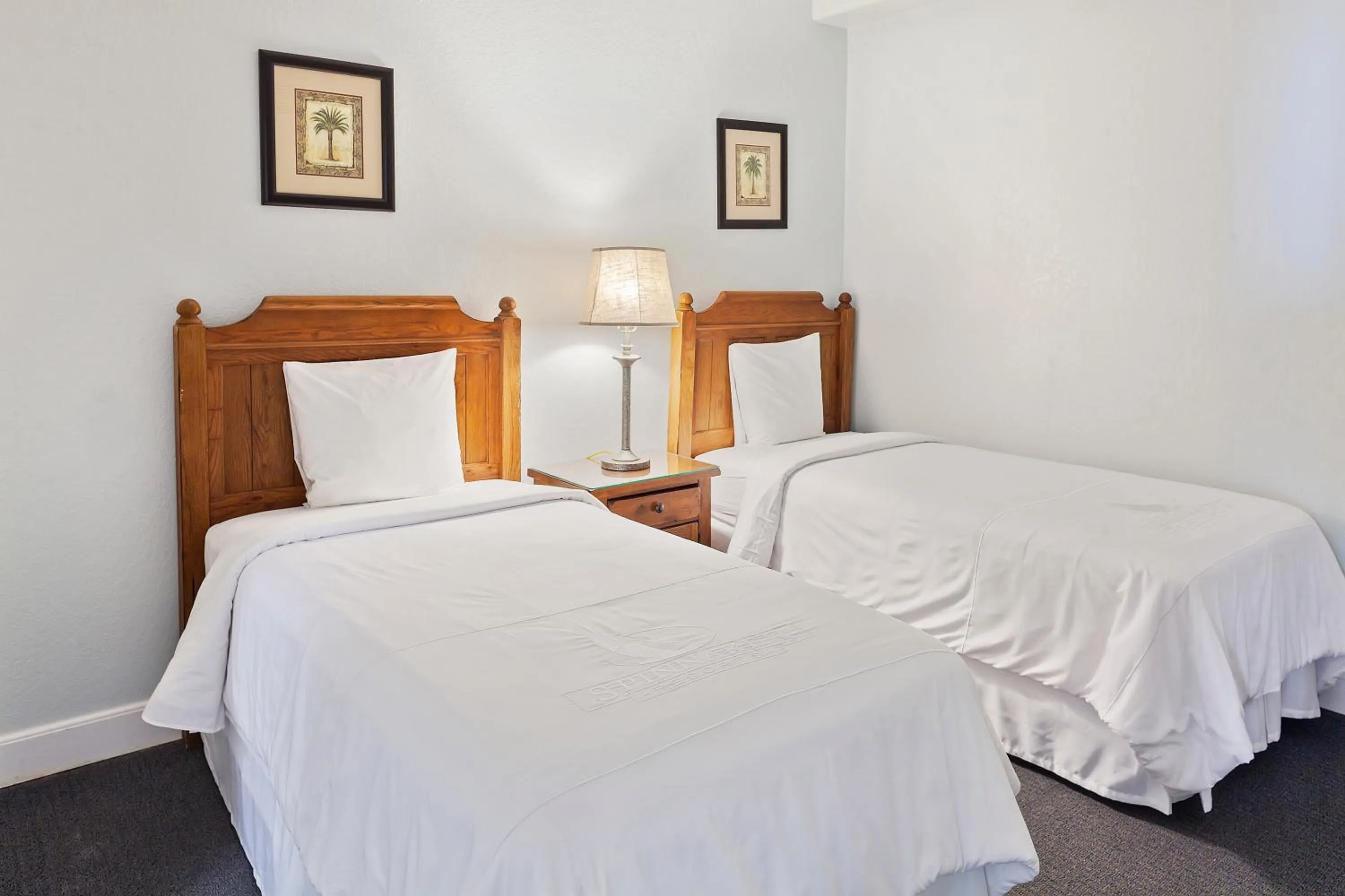 Bed in Royal Floridian Resort South by Spinnaker