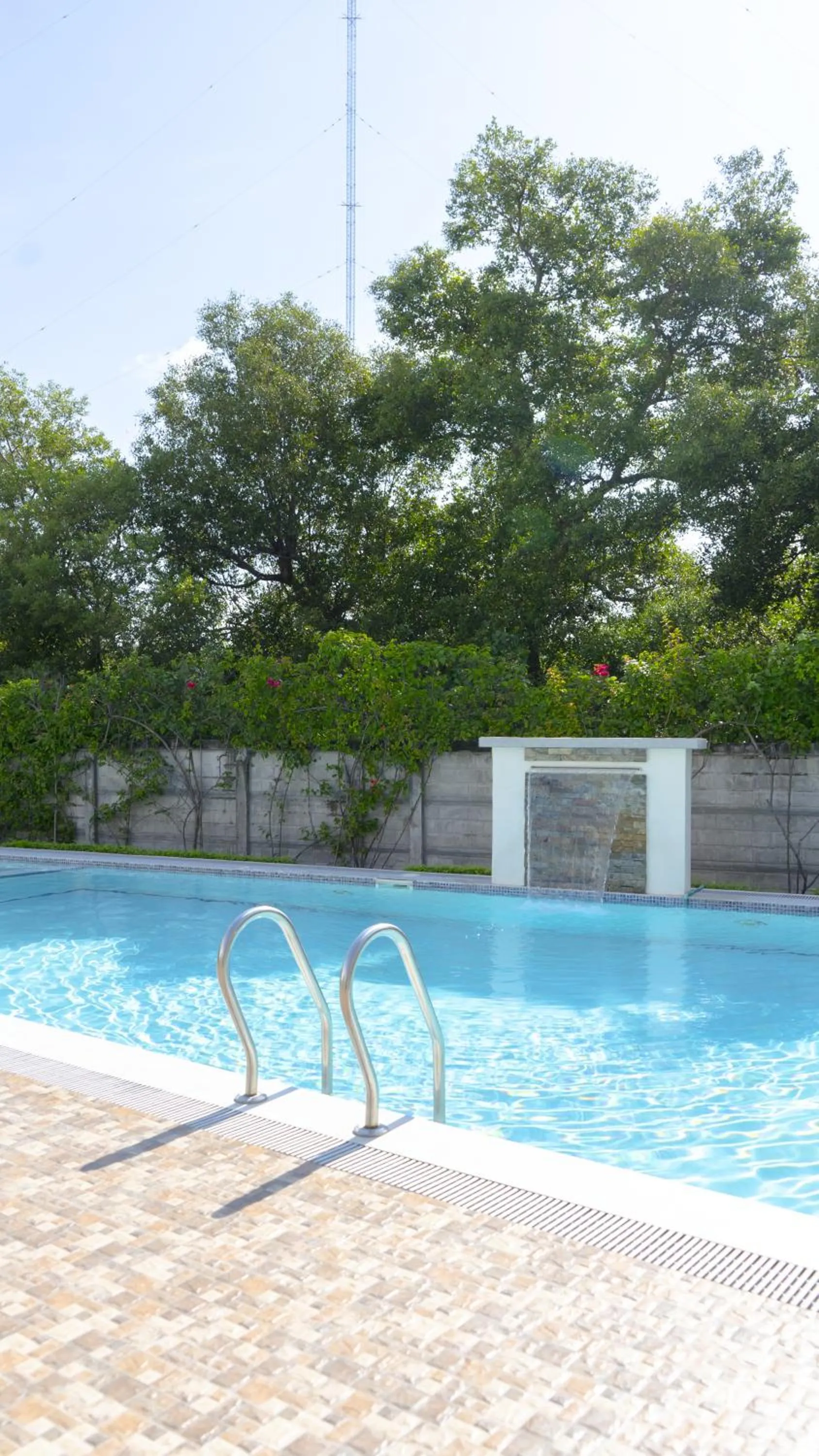 Pool view in Cozy 1-bed unit near SRP Talisay Cebu