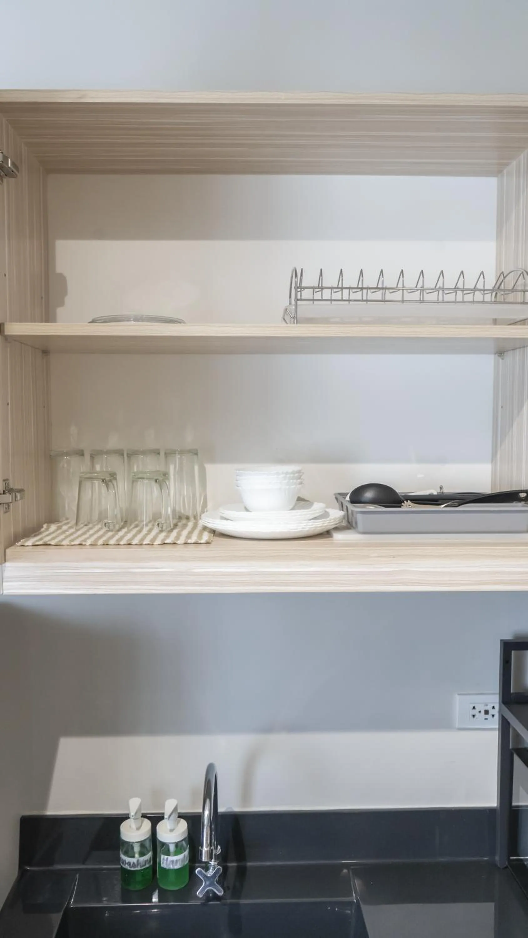 Kitchen or kitchenette in Cozy 1-bed unit near SRP Talisay Cebu