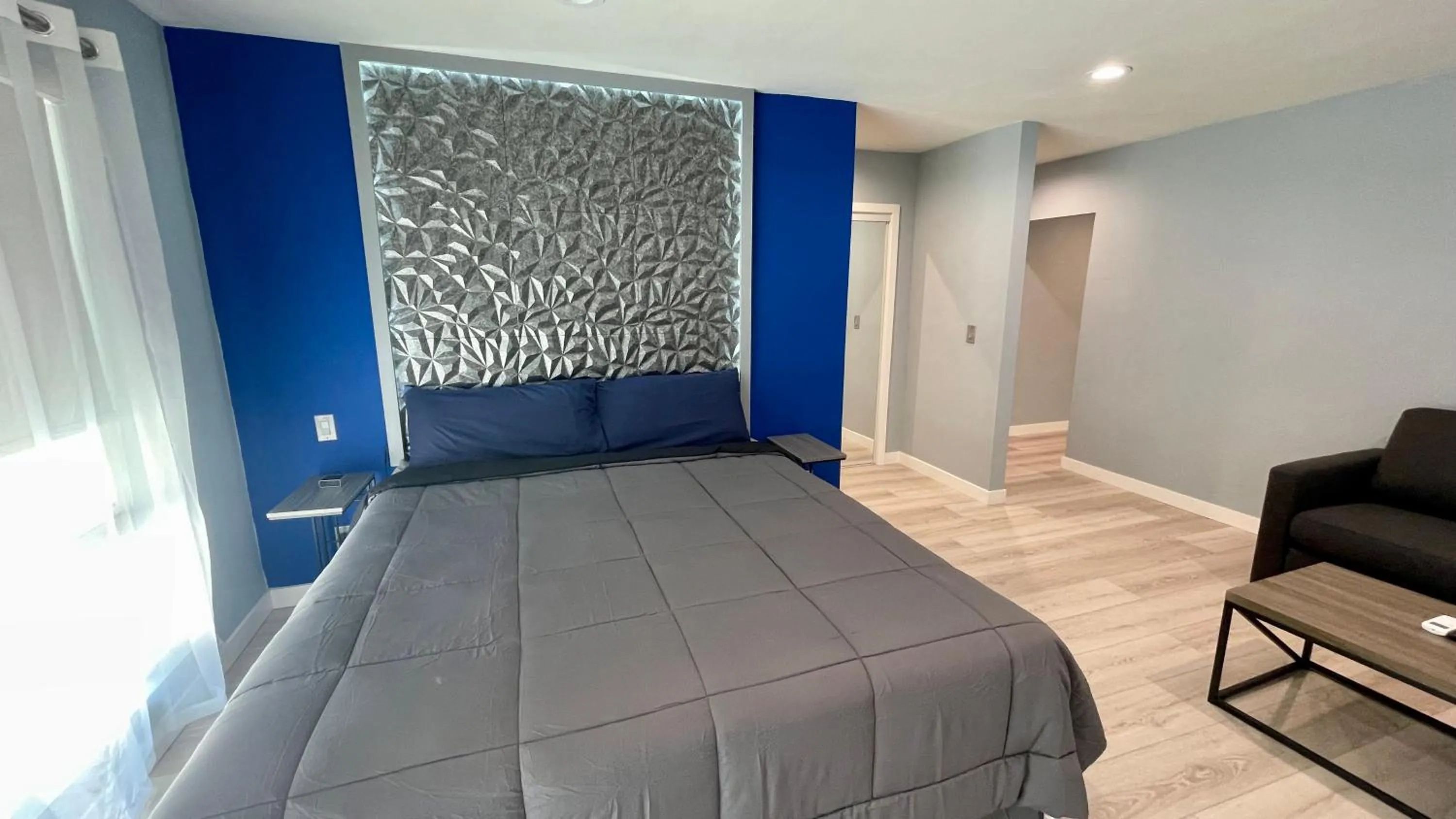 Bed in Quintessence ApartHotel