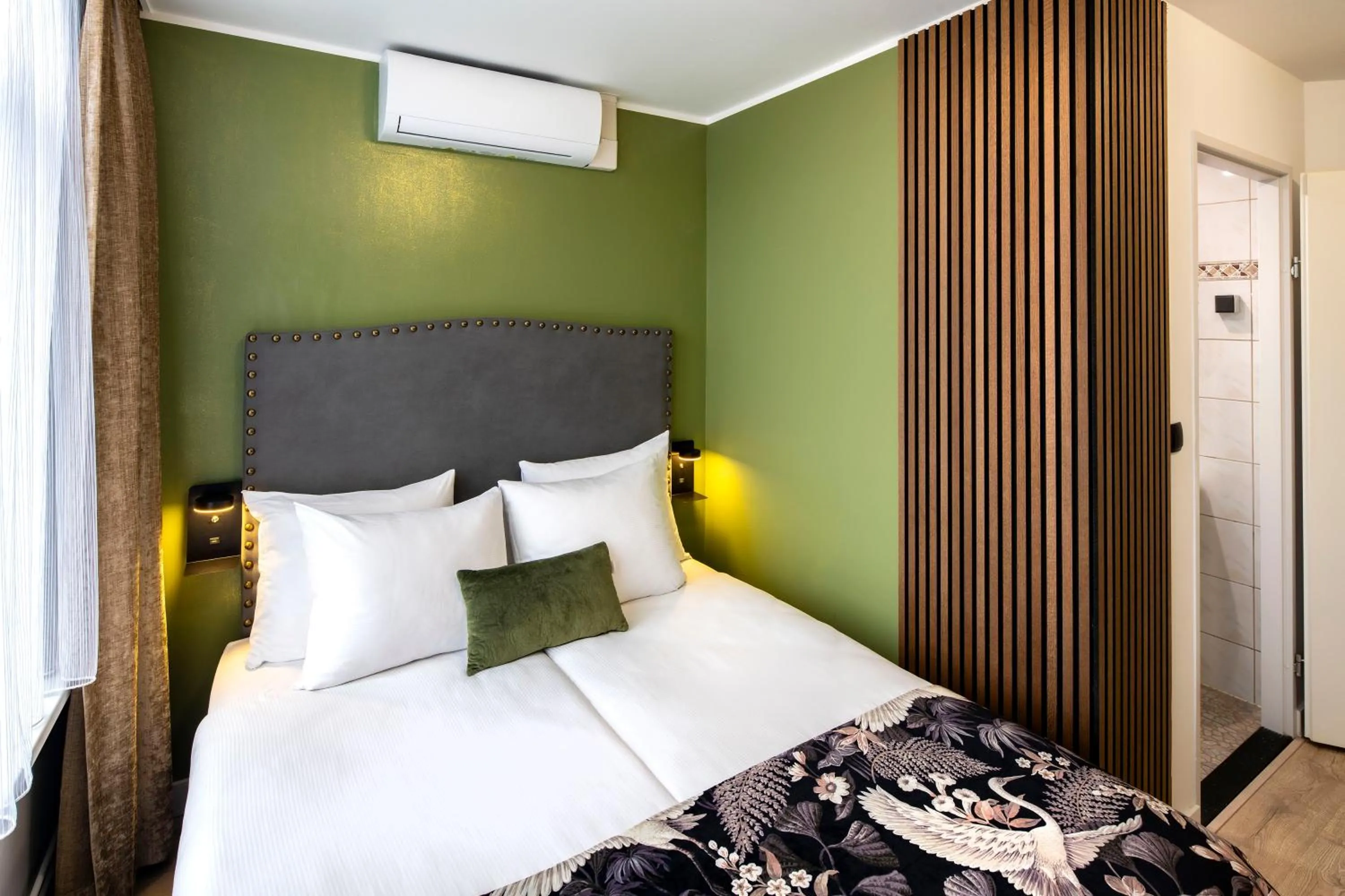 Bed in Jupiter Hotel