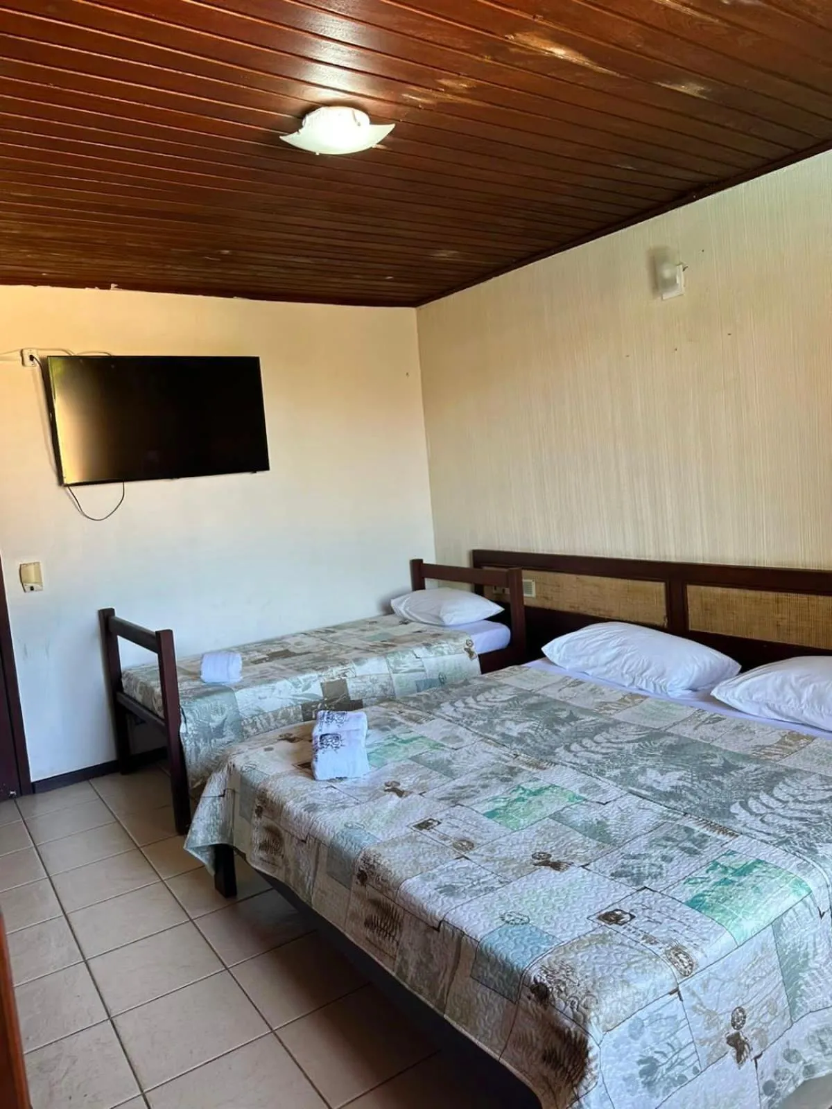 Bed in Pousada Navegantes Beach